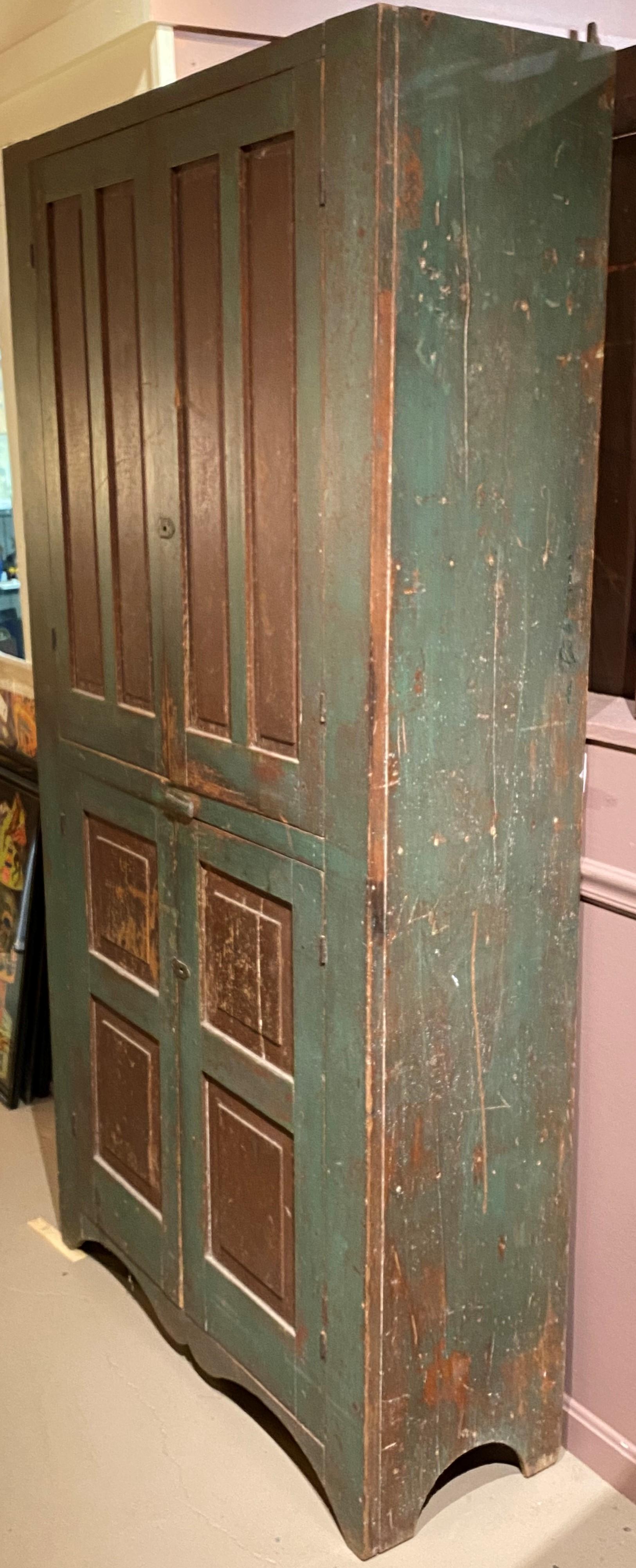 Pine Early 19th Century New England Paneled Cupboard in Green & Reddish Brown Paint For Sale