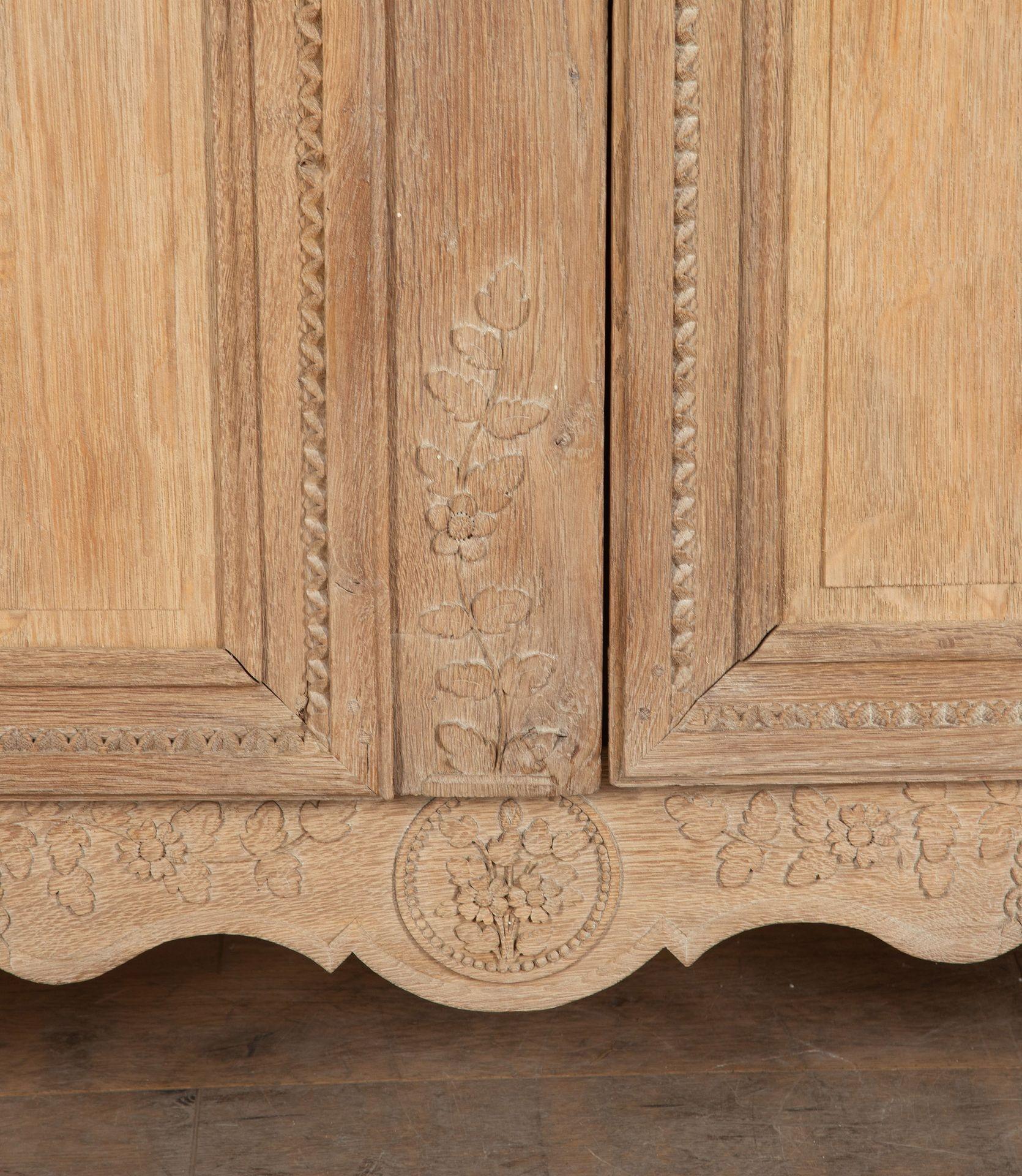 Early 19th Century Norman marriage oak armoire.
Finely hand carved throughout with a scrubbed back bleached finish and original iron fittings.