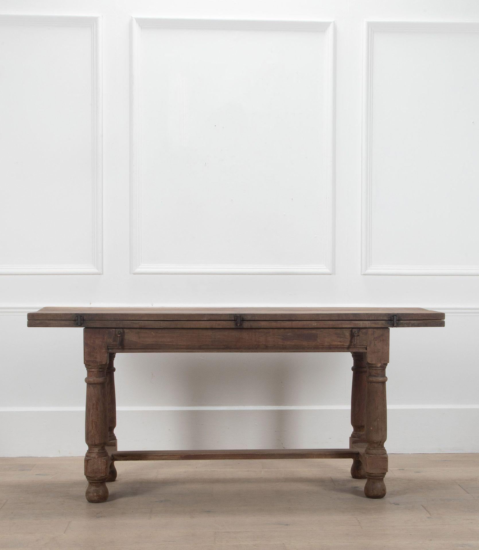 19th Century light oak fold-out dining table.

Circa 1800.