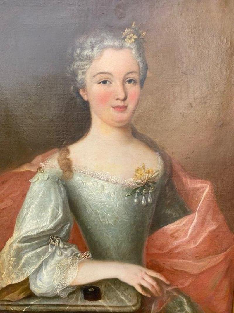 Early 19th century Oil Painting of 18th century Noble Woman. The gray haired woman is in a lovely light blue corset dress draped in a salmon color wrap. Recently reframed. Measures: 38