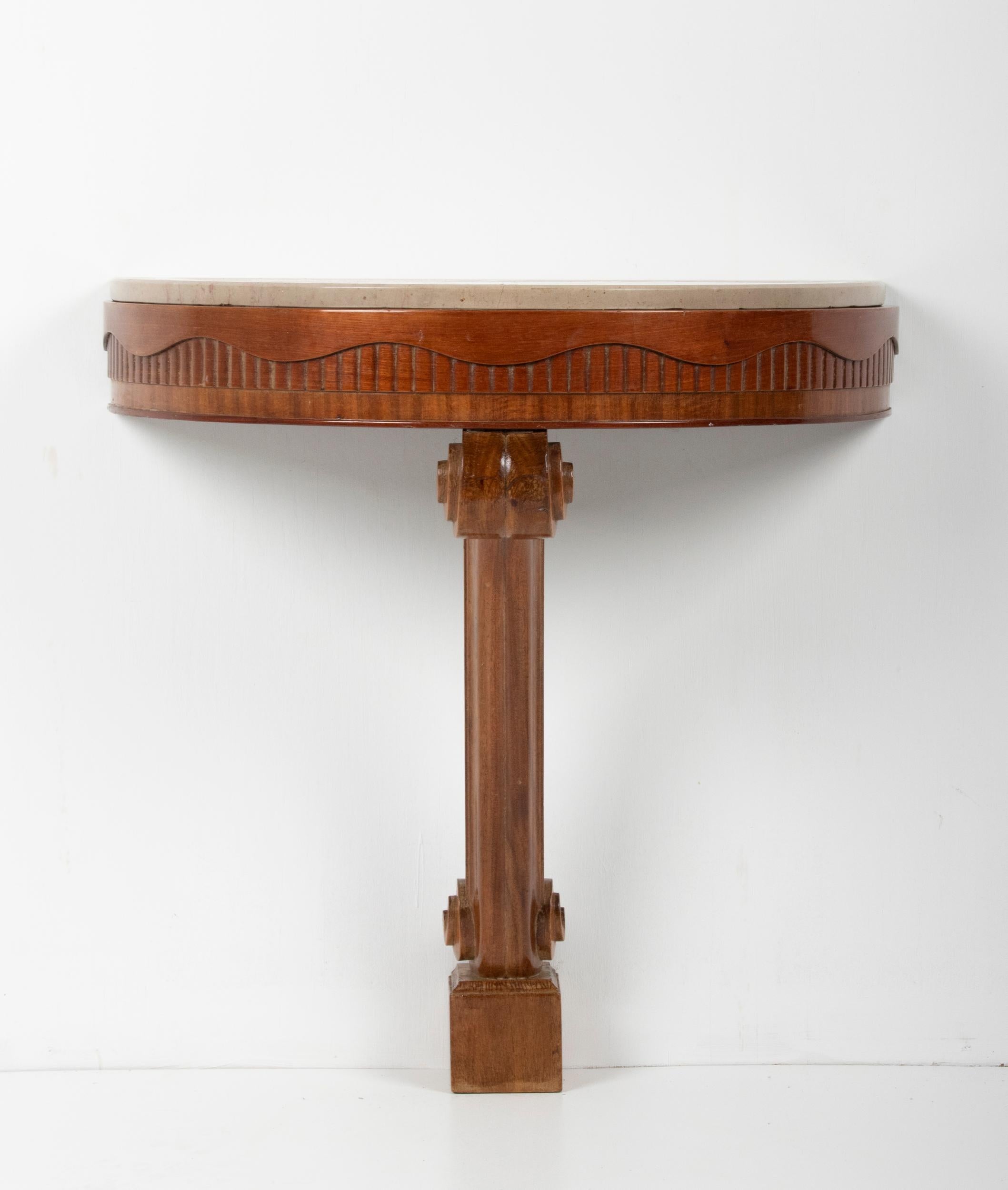 A French elegant single-leg console table with marble top in Art Deco style, made in France, circa 1920-1930. The table rests on a bent cabriole leg. The table is made of beech wood. The table must be fixed to the wall.