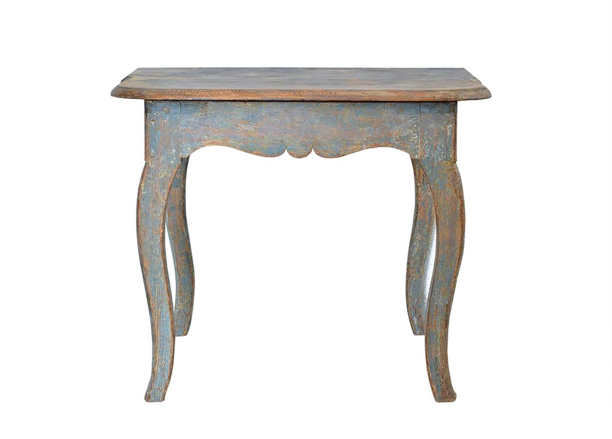 This Swedish Provincial Rocco table was manufactured in the early 19th century and has been dry scraped to its original paint.