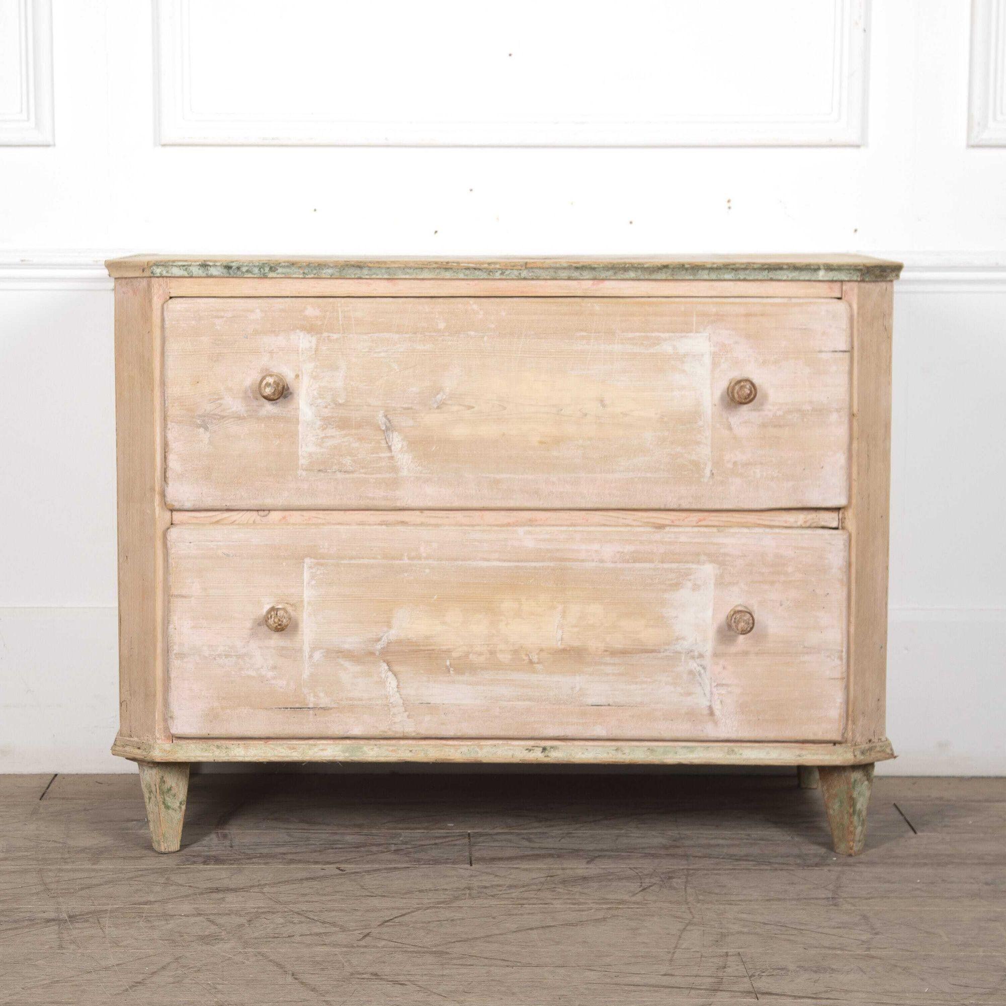 A charming early 19th century 2-drawer commode in remnants of the original pink and white paint. Denmark c.1820.