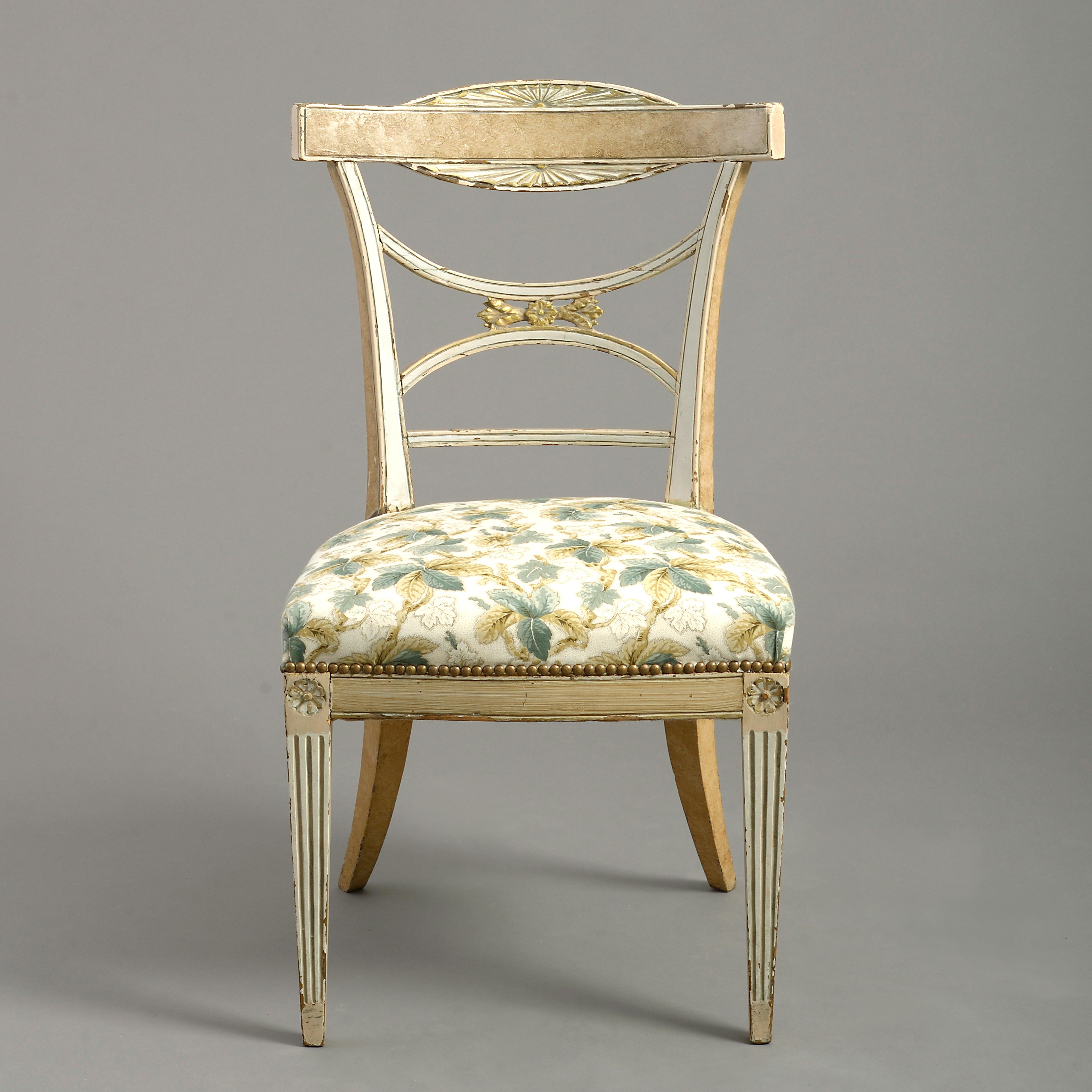 A fine early 19th century Gustavian period painted side chair in the classical manner, the shaped and tapering back set upon an over-stuffed seat, all raised upon square tapering fluted legs, headed with paterae.
   