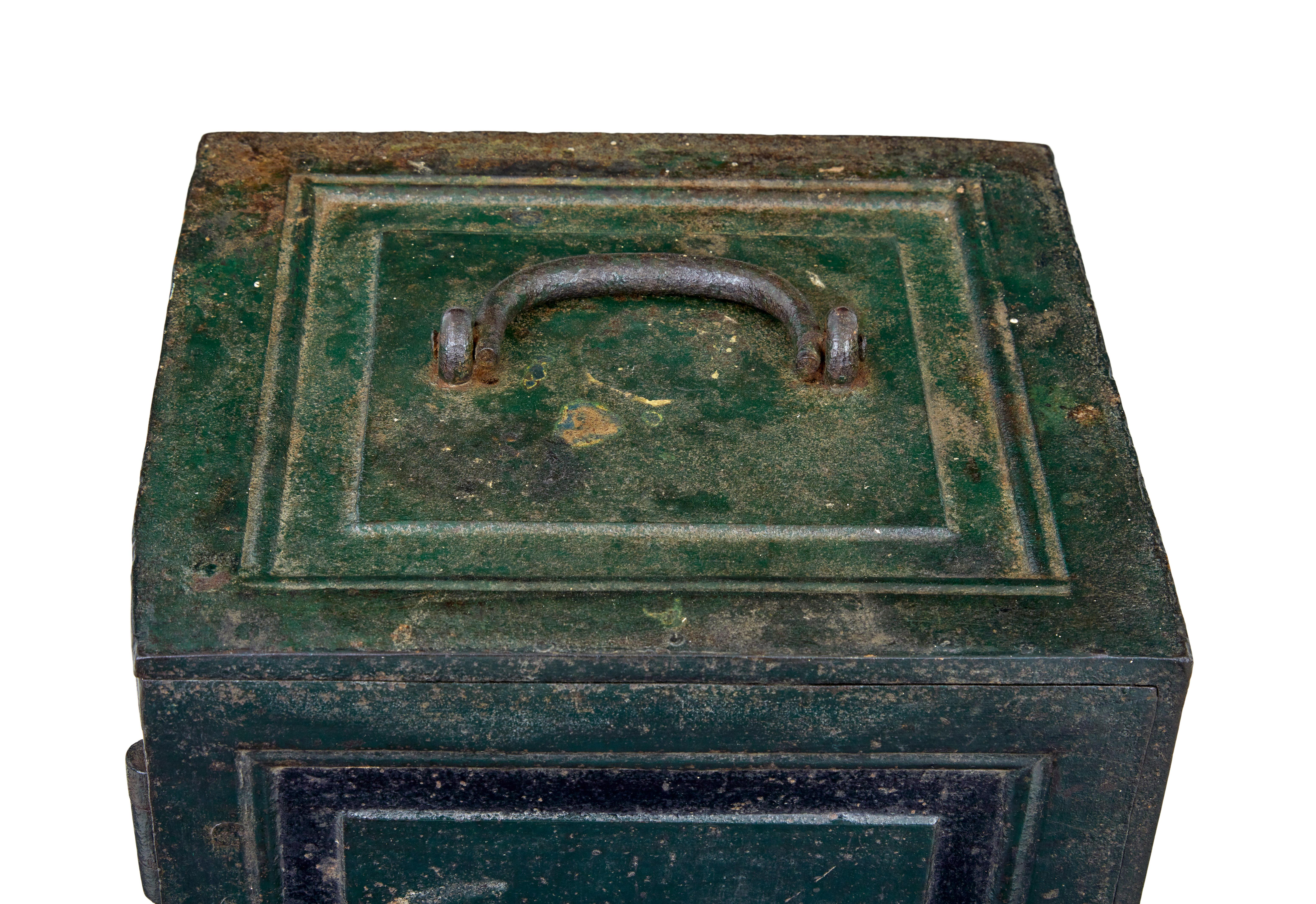 Early 19th century painted iron safe circa 1830.

We are pleased to offer this cast iron safe in near original condition and still functioning today.

Cast fielded panels to front and sides, original key still works the functioning lock, door opens