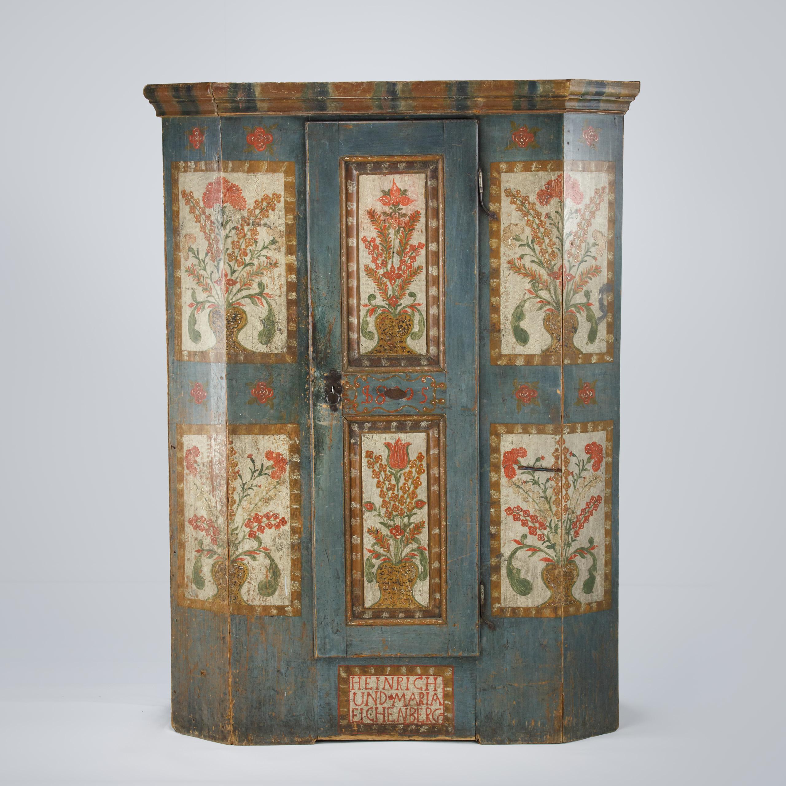 A Fine Painted Folk Art Marriage Cupboard. Original blue painted base with Floral motifs to the panels Central panel below door with the couples name painted Heinrich und Maria Eichenberg. Dated to the door 1805. Original stylised painted