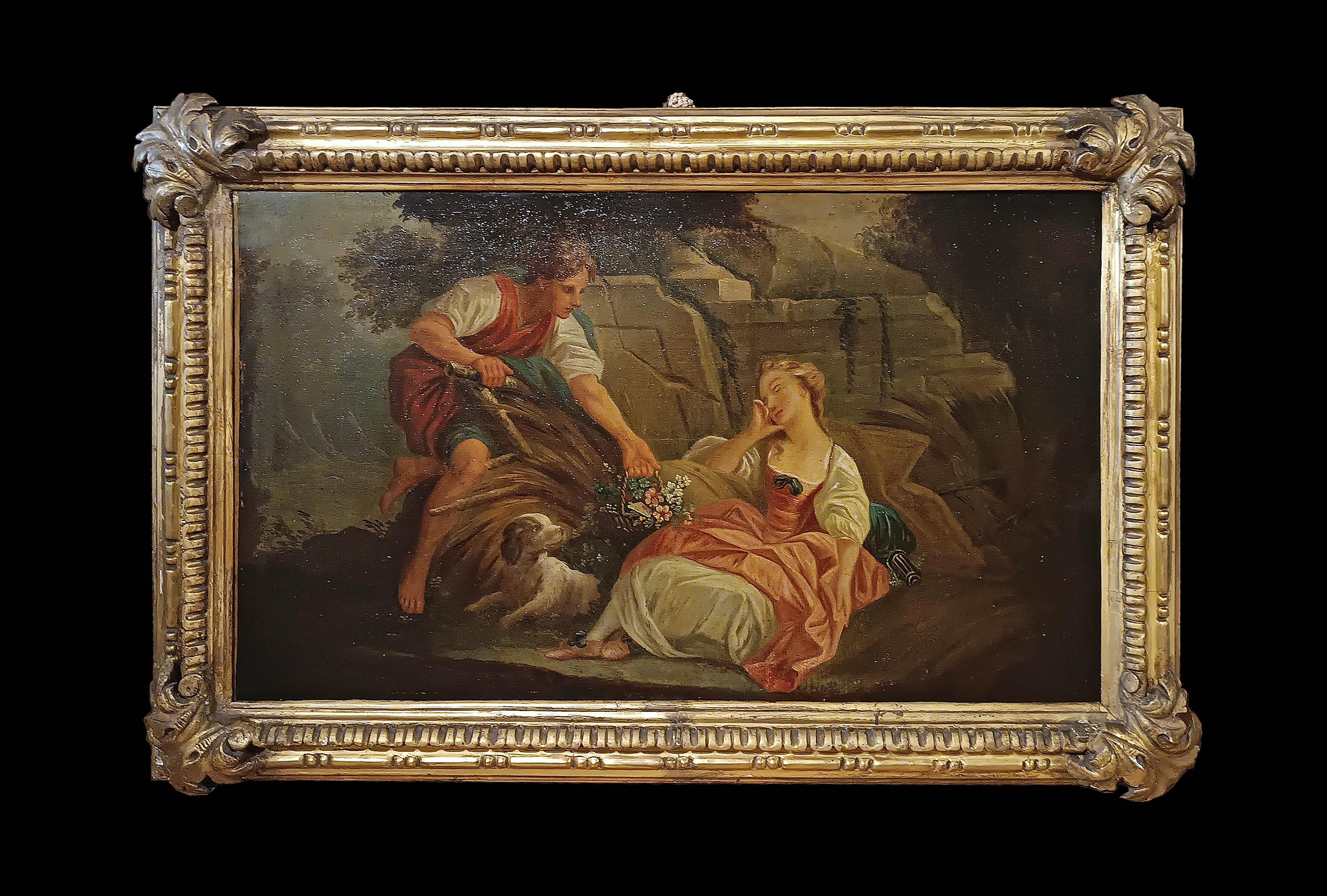Splendid oil painting on canvas, framed in a carved and gilded pine wood frame with floral motifs. The painting depicts a gallant scene in an idyllic landscape, with ruins and trees. A young man bends toward a girl sitting among the wheat, offering