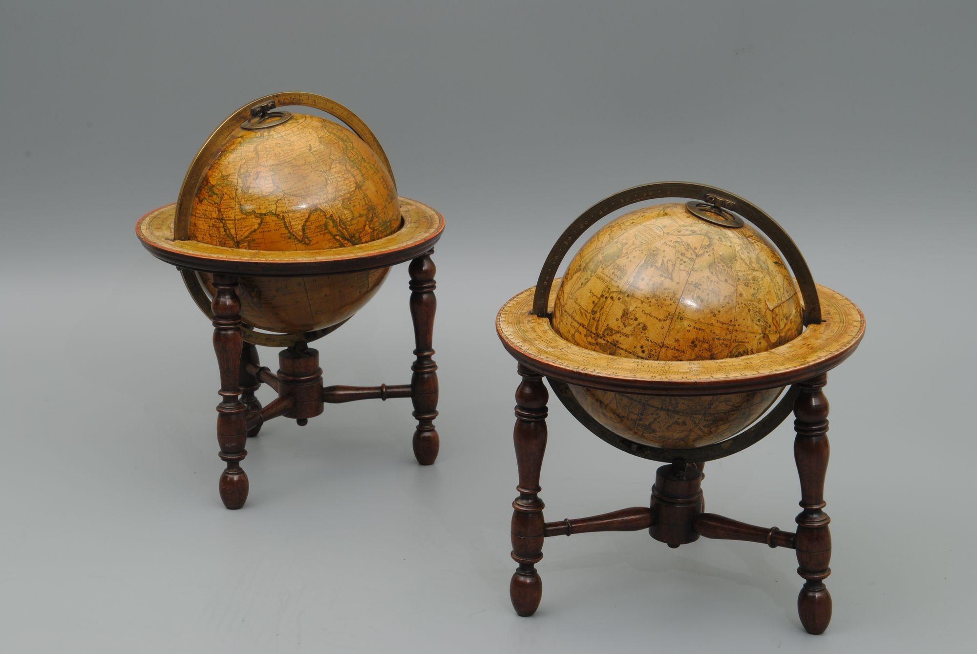 A charming pair of celestial and terrestrial early 19th century table globes of a rare small size by Newton, London.