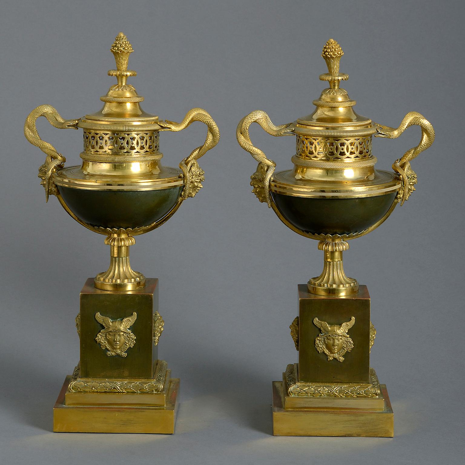 A pair of early 19th century bronze and ormolu perfume burners or pot-pourri vases of exceptional quality and in the celebrated form of Sevrés ‘Daguerre ovale’ or ‘cassolette à monter’. Each Brûle Parfum in the form of urns with pierced guilloche