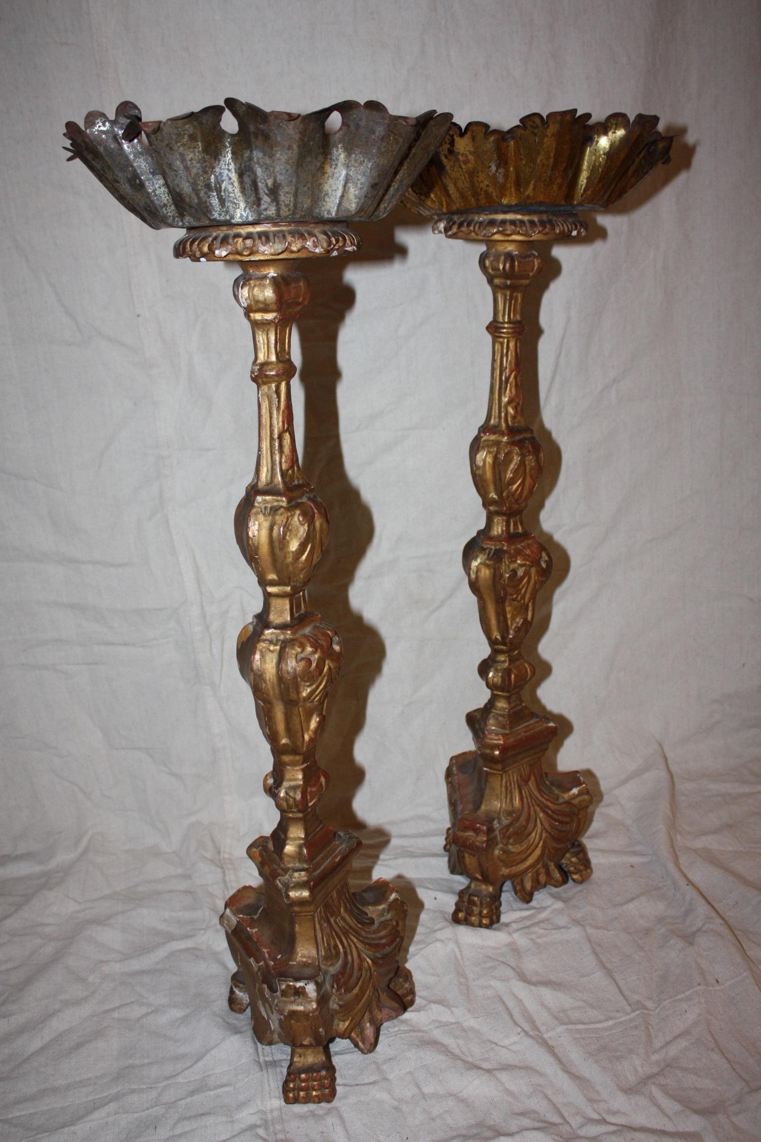 This is a great looking pair of tall Italian candlesticks dating to the early 1800s.

Dimensions below are taken at the base of the candles. The height is 27