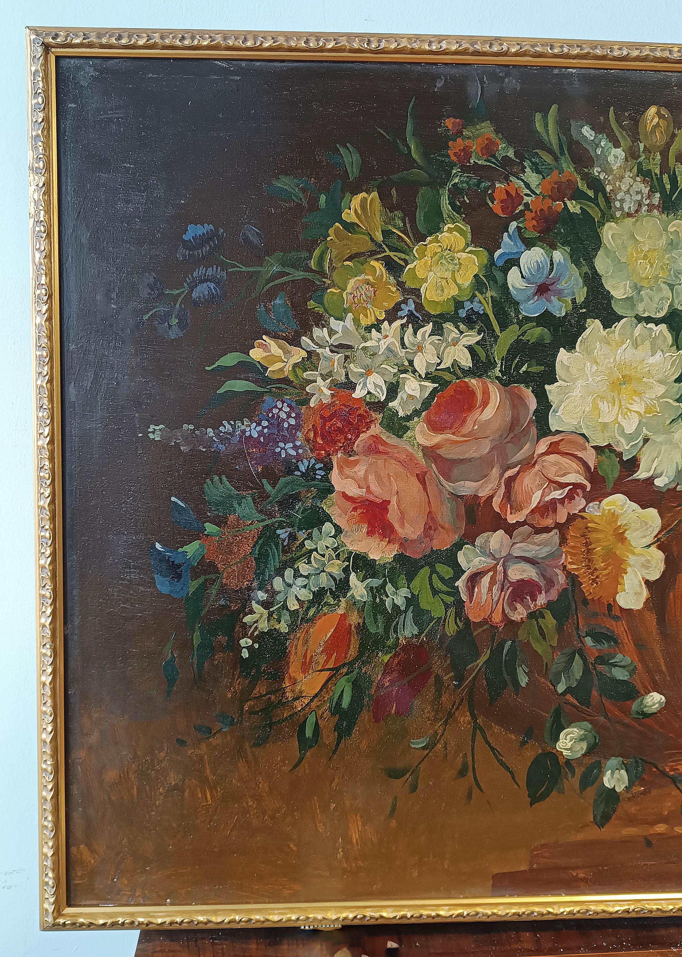 Pair of oil paintings on wooden panels, framed in a carved and gilded wooden frame. The paintings depict two still lifes with flowers, placed in bronze vases of the 