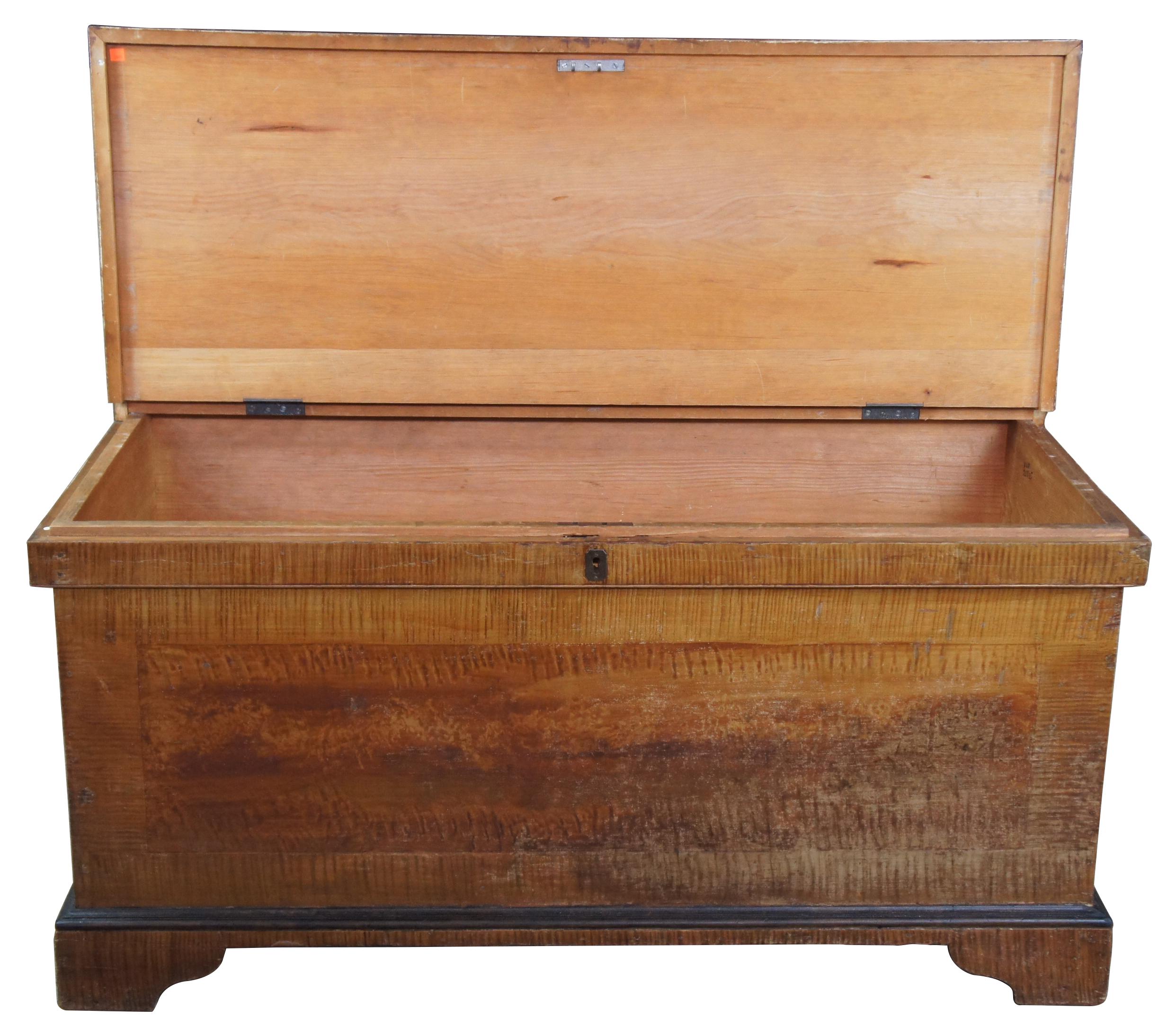 Early 1800s Pennsylvania chest. Made from pine with a tiger maple painted grain exterior. Features inset heavy duty iron handles and bracket feet.