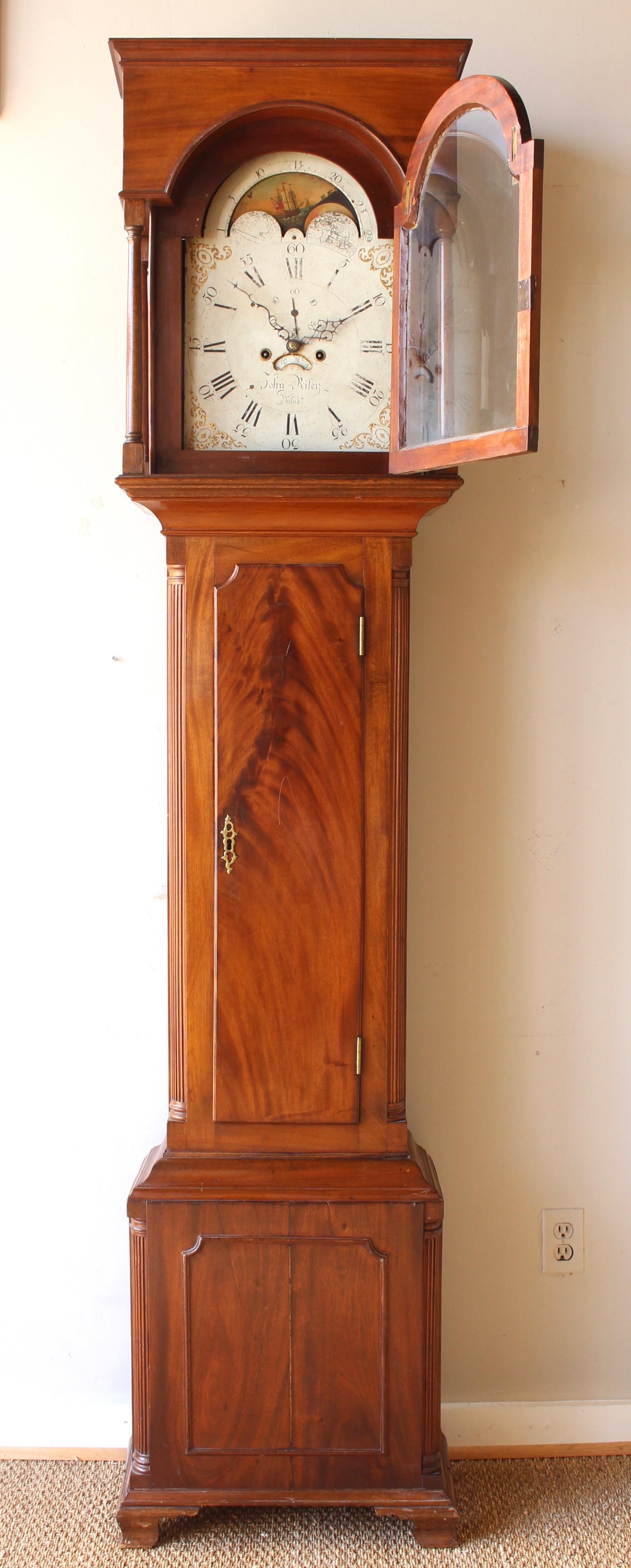 An elegant early 19th century mahogany Philadelphia tall case clock featuring a second hand and phases of the moon and days of the month complications by John Riley.