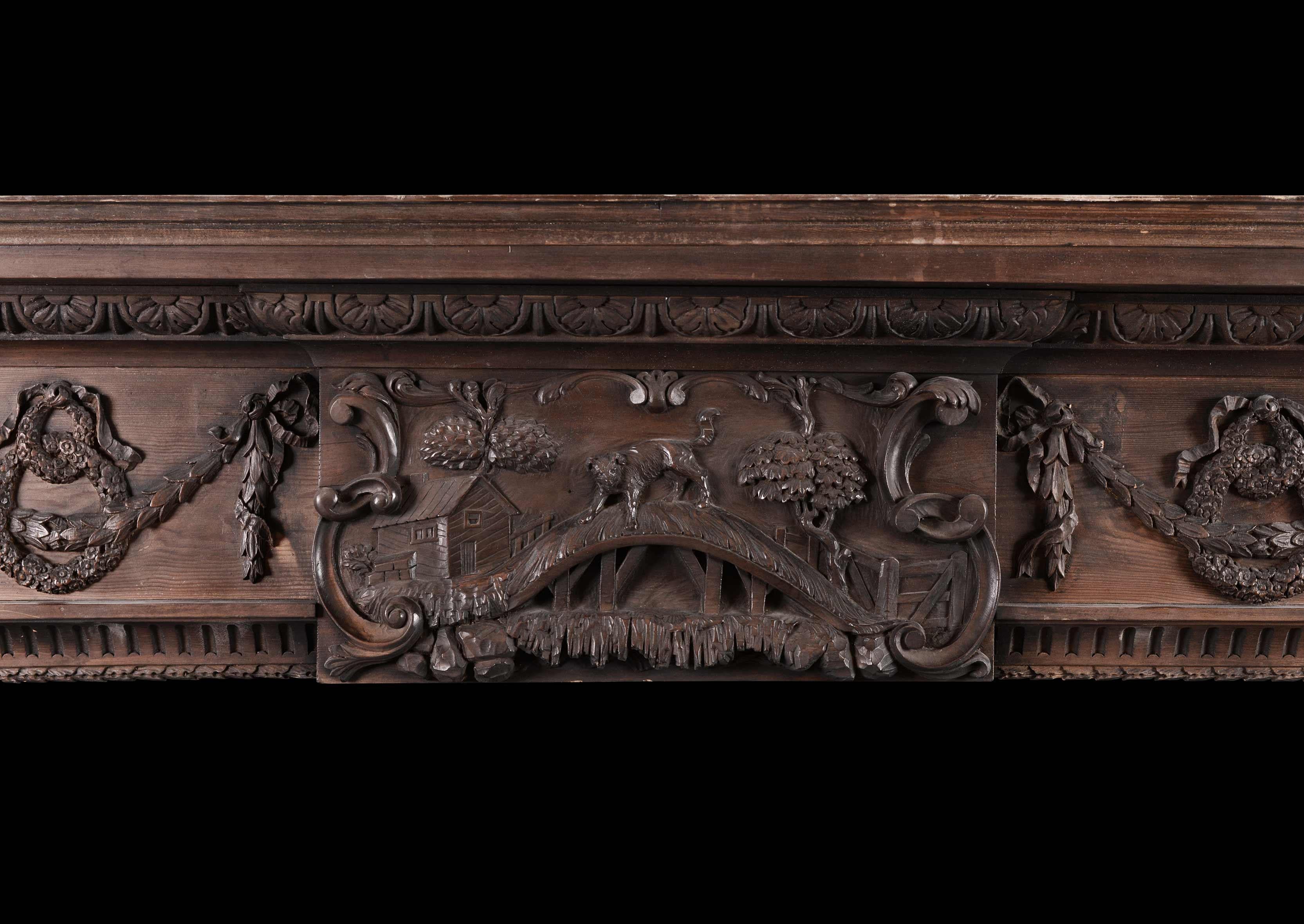 A good quality and unusual early 19th century pine fireplace. The carved centre plaque depicting the Aesop's fable of 