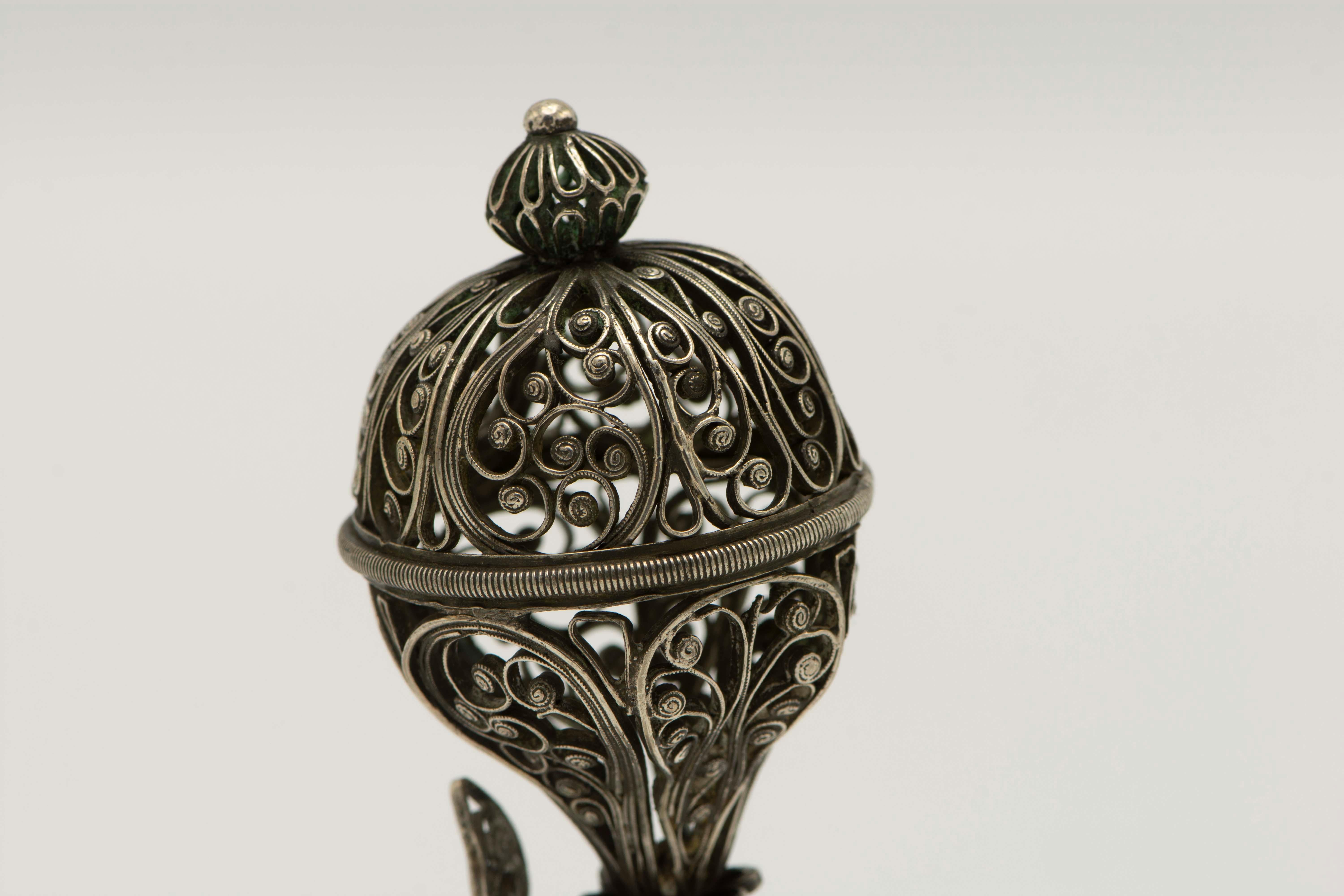 Handmade silver and silver filigree spice container, Poland, circa 1820. 
On a round base decorated with silver filigree with vine shaped stem that leads to silver filigree upper fruit form portion. 
 
 Every item in Menorah Galleries is