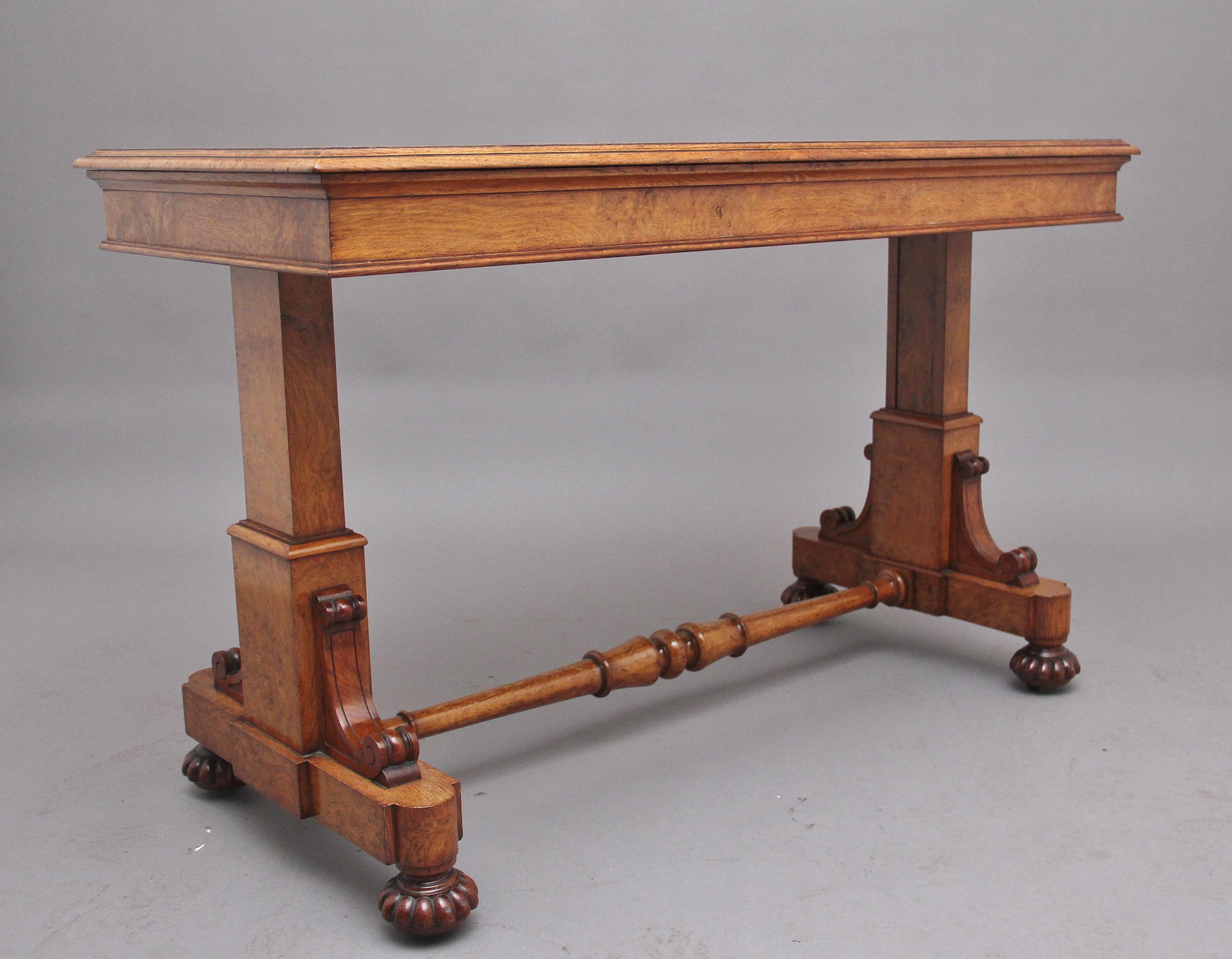 A superb quality early 19th Century pollard oak buffet / dumb waiter, having a lovely figured top with a moulded edge supported on two end supports decorated with carved corner brackets, standing on carved turned feet united by a turned stretcher.