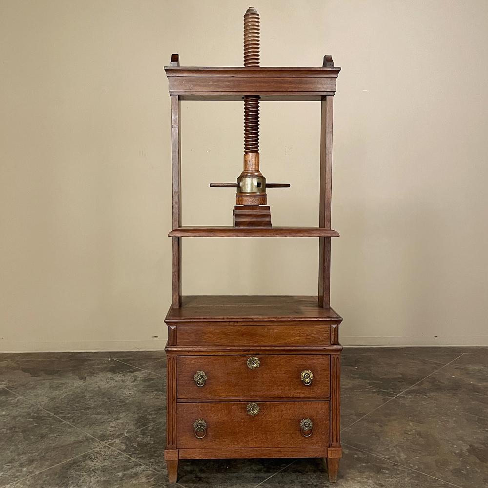 Early 19th century Printer's paper press is a superlative artifact from a bygone era, that will provide storage like a chest of drawers, an intriguing table surface, and the start of many interesting conversations! Two centuries ago paper was not as