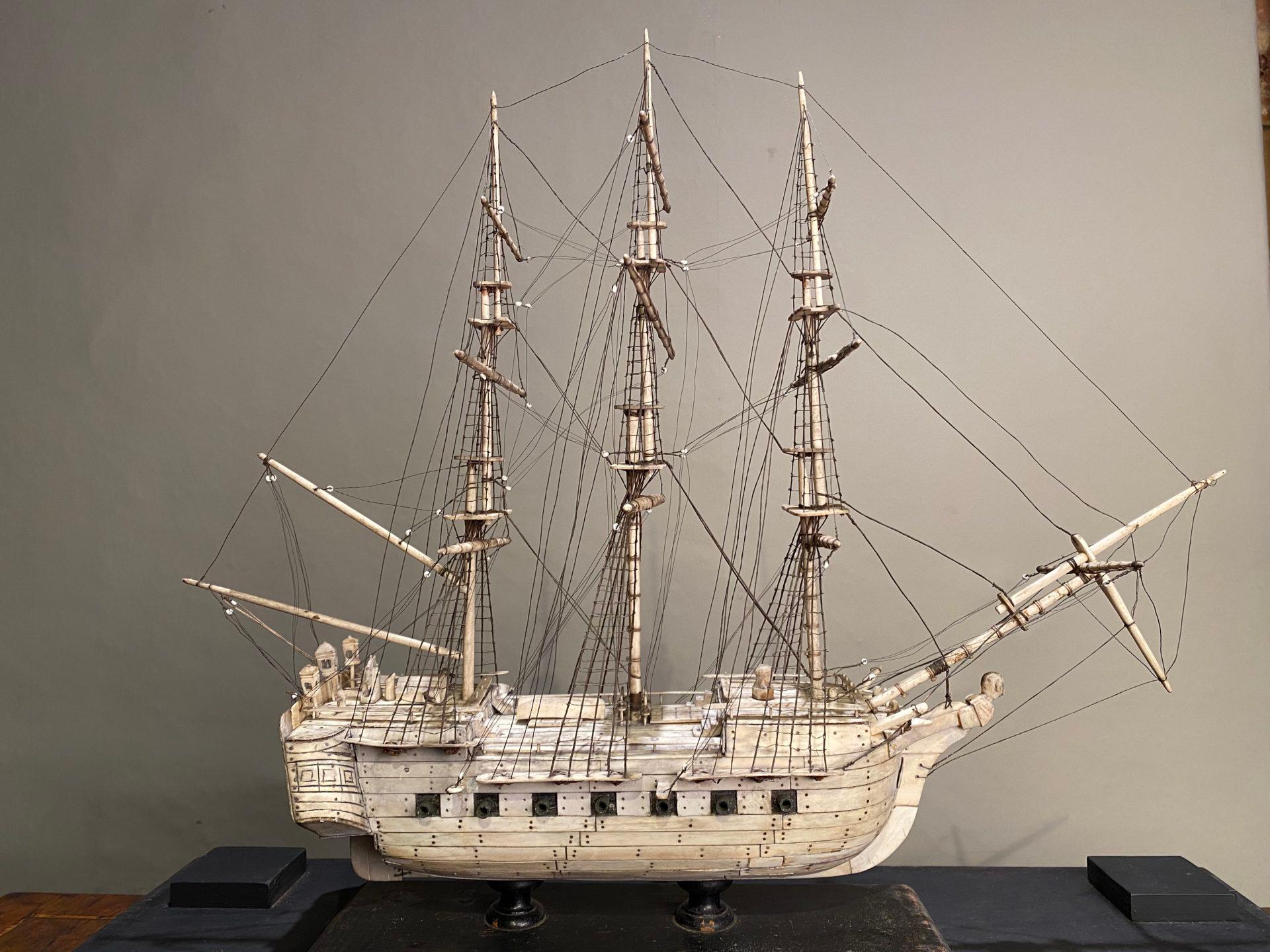 A Napoleonic prisoner-of-war model ship, ca 1815. In a glazed ebonized case.
In lovely condition throughout. 

This antique bone ship’s model was made by a prisoner of war during a long period of captivity - in the course of the Napoleonic Wars