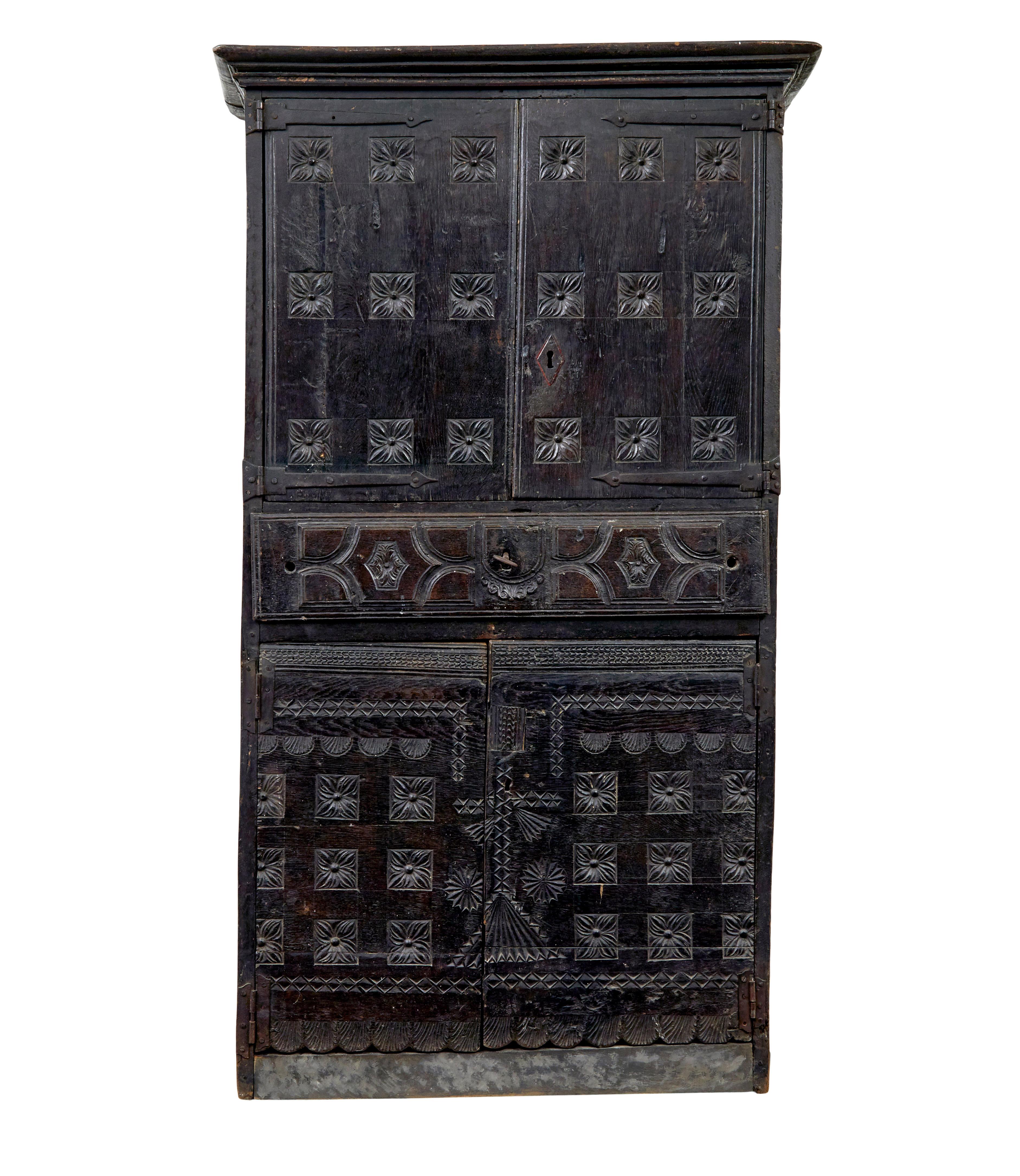 Early 19th century pyrenean folk art oak and chestnut cupboard circa 1800.

Beautiful rustic cupboard from the pyrenees region of the french spanish border.  Oak carcass with stunning carved chestnut doors and drawers.

Slightly over-sailing top