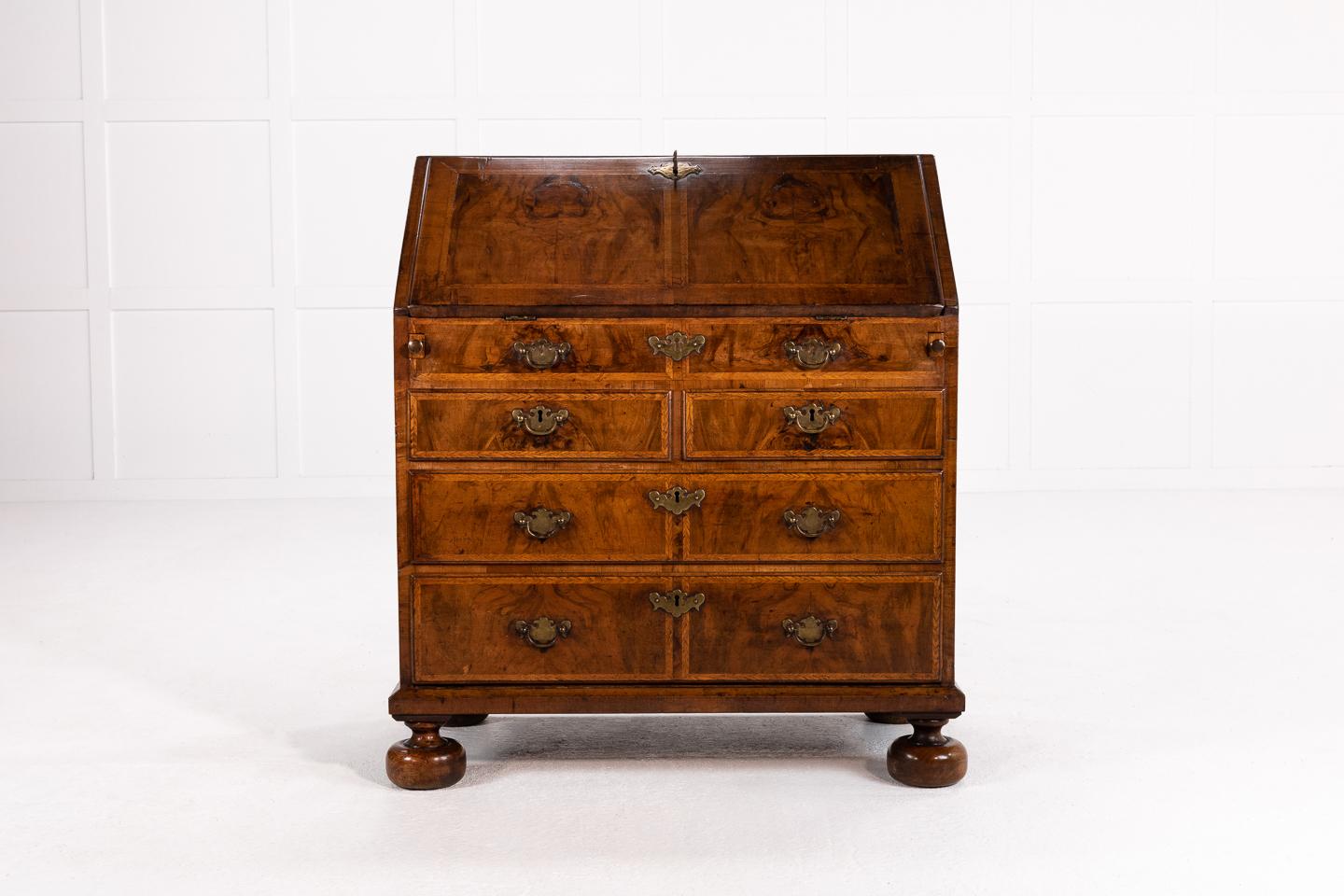 Nice, small proportioned early 18th century Queen Anne walnut bureau with lovely interior.