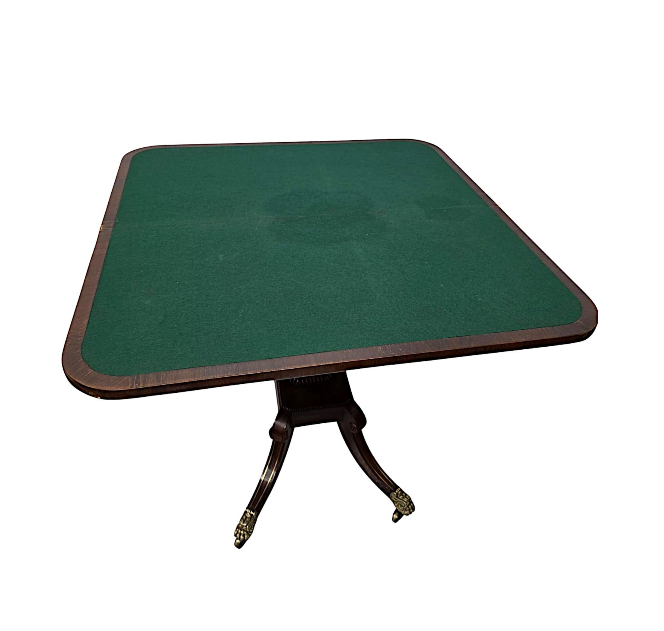 A fabulous early 19th Century Regency rosewood card table with well cast brass inlay throughout.  This stunning piece is of exceptional quality, finely hand carved with rich patination and grain.  The well figured moulded, hinged top of D-end form
