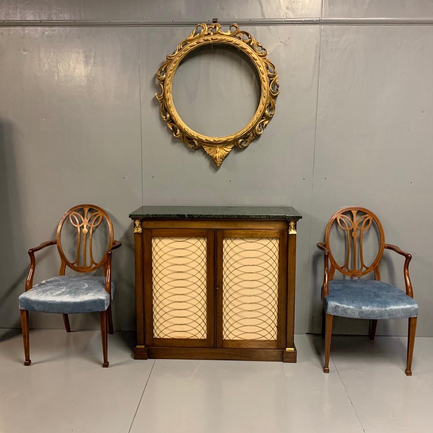 Very elegantly proportioned Regency two door pier cabinet or chiffonier with brass Sphinx columns and brass lattice grille, finished with a stunning green shaped marble top.
Lovely condition, showing very little signs of previous restoration, so