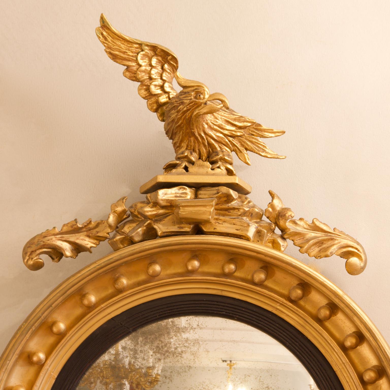 English Early 19th Century Regency Eagle Figure Round Giltwood Convex Wall Mirror