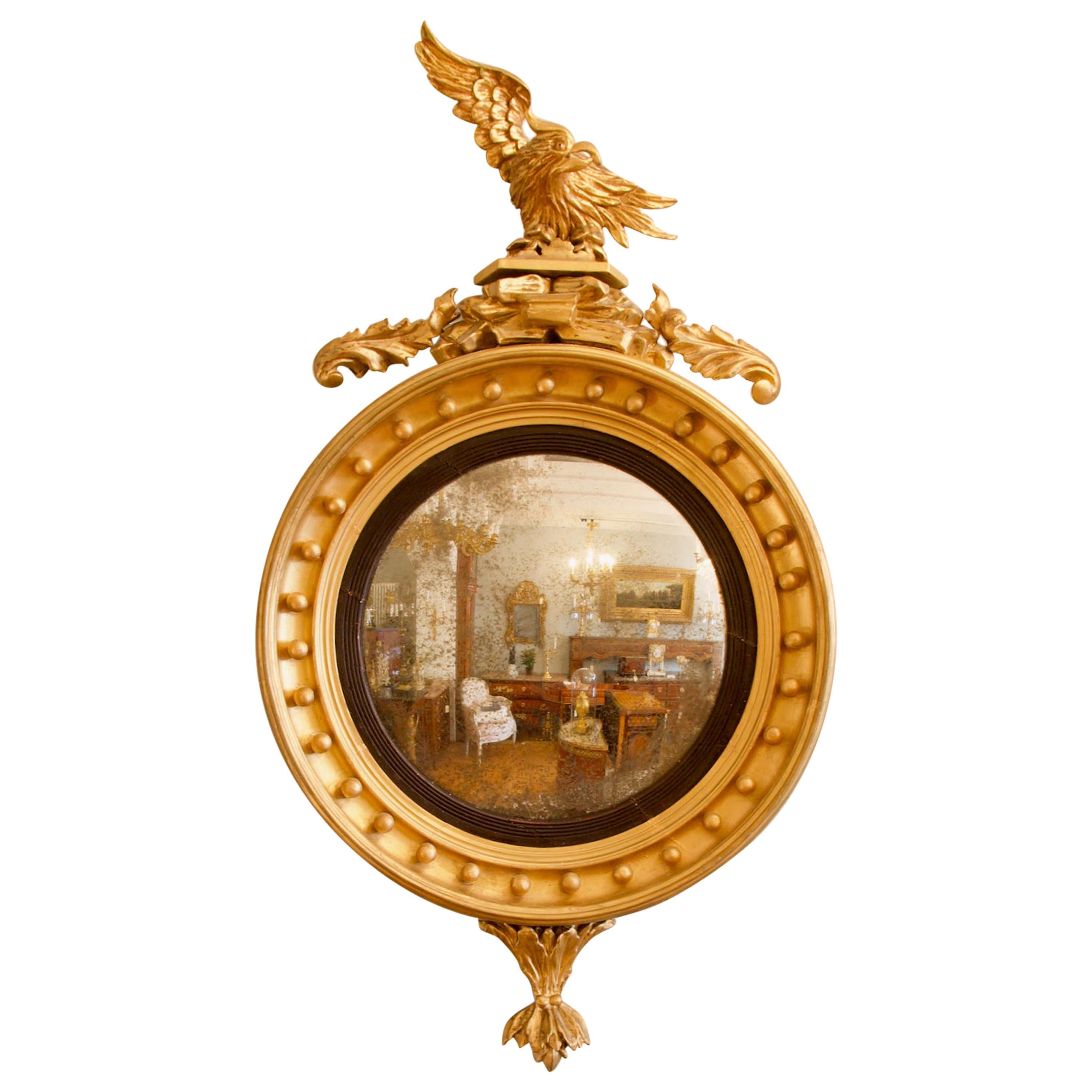 Early 19th Century Regency Eagle Figure Round Giltwood Convex Wall Mirror