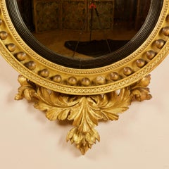 Early 19th Century Regency Eagle Round Gilt and Ebonized Wood Convex Wall Mirror