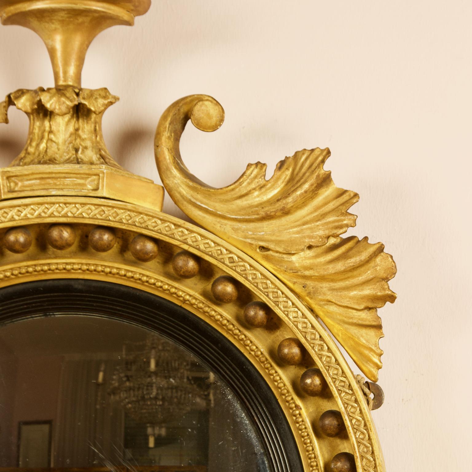 Carved Early 19th Century Regency Eagle Round Gilt and Ebonized Wood Convex Wall Mirror