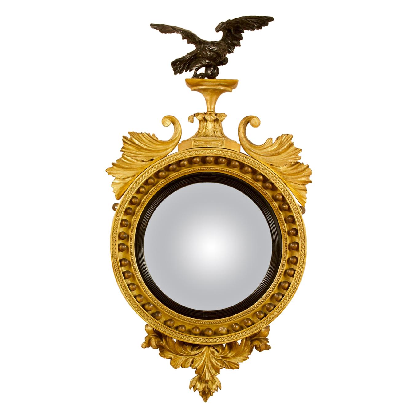 Early 19th Century Regency Eagle Round Gilt and Ebonized Wood Convex Wall Mirror
