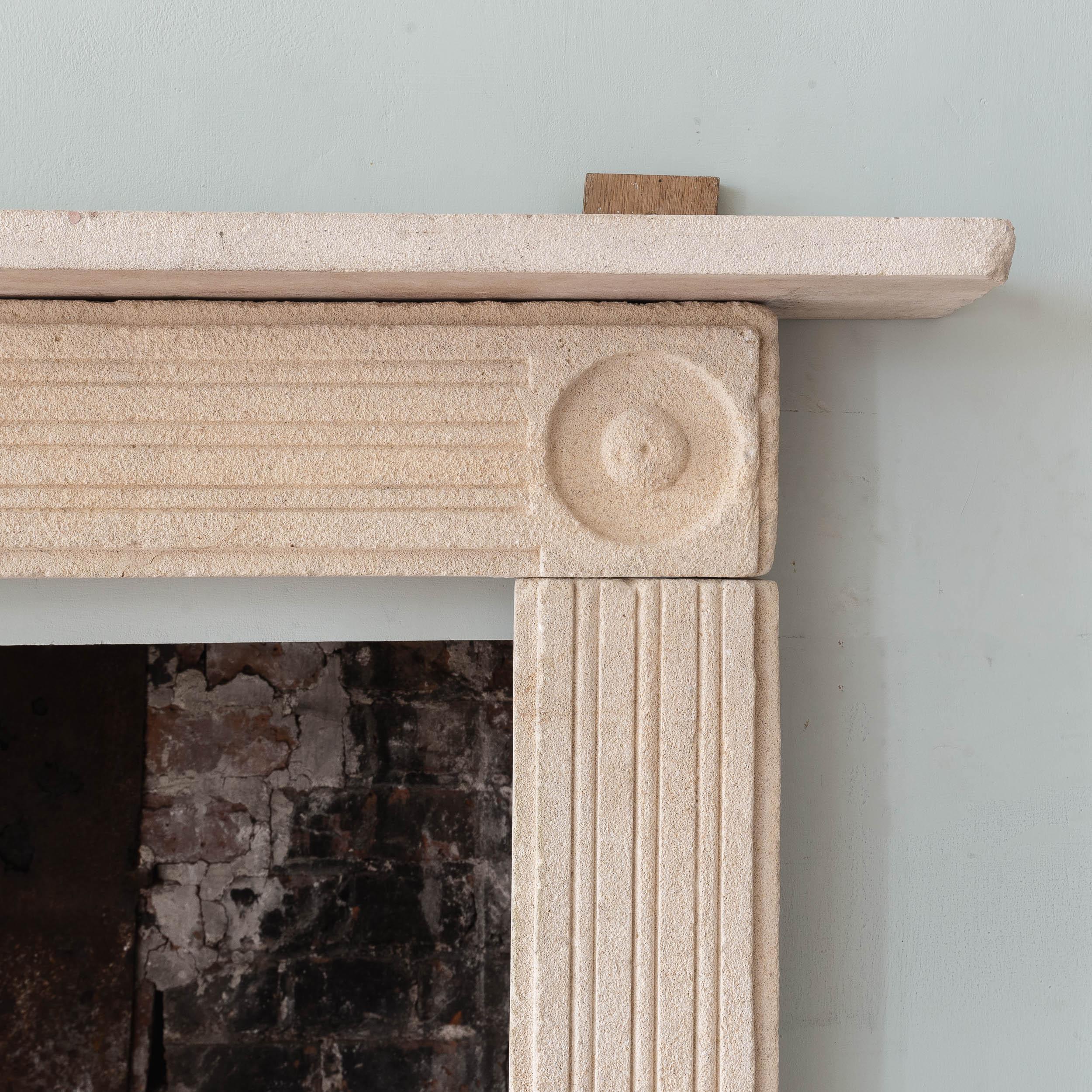 An early nineteenth century Regency fireplace, with cushion mould tablet to the centre, with reeded frieze and jambs. Shelf a later replacement.

Dimensions:	118cm (46½