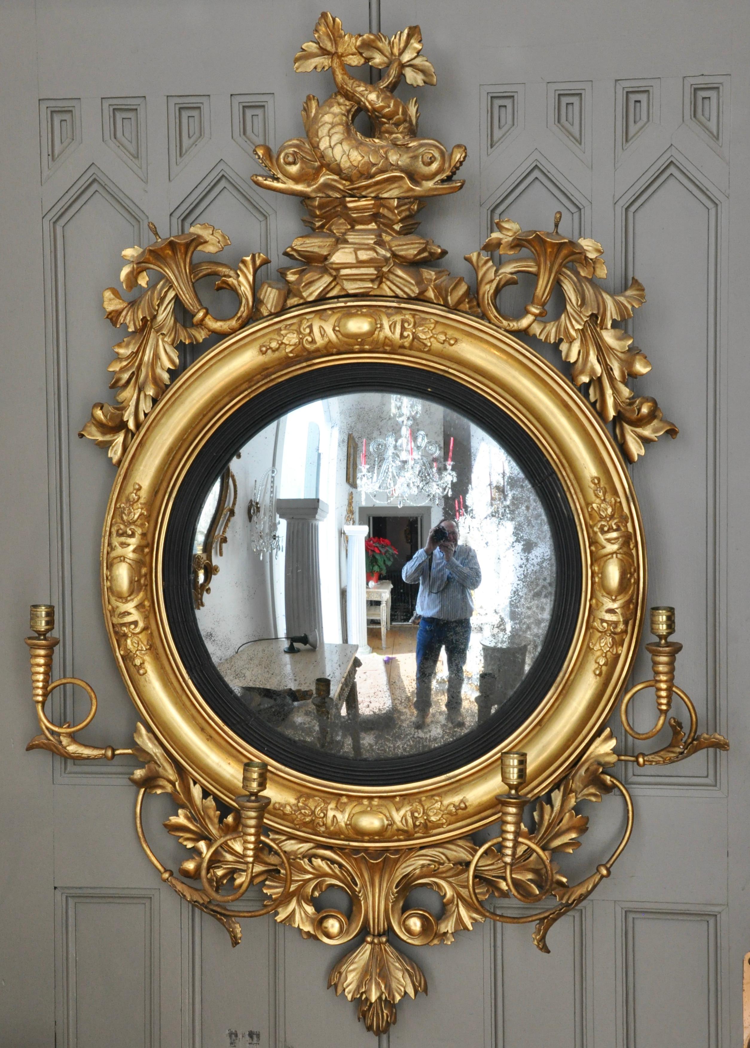 Period English Regency giltwood convex girandole mirror. Dolphin top. Original candle arms. Original gilding. Original Mirror

--Provenance: Museum of Fine Arts, Boston, Loan Exhibition, 1917-25, Loan # 351.17.