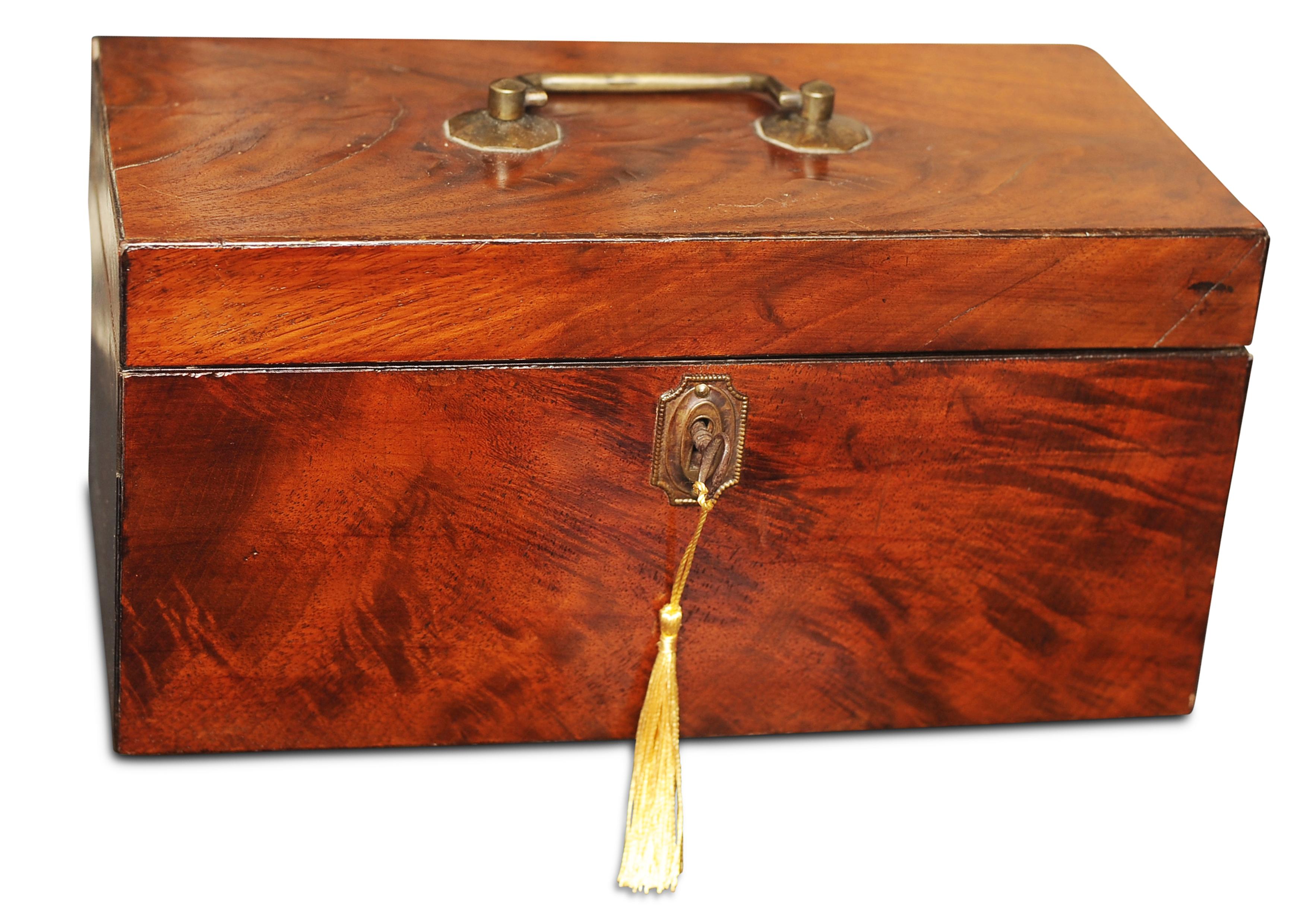 Regency period early 19th century flame mahogany tea caddy box with swing handle complete with an original hallmarked sterling silver George III tea caddy spoon

Comes with working key, item opens to reveal a fitted interior with twin caddies &