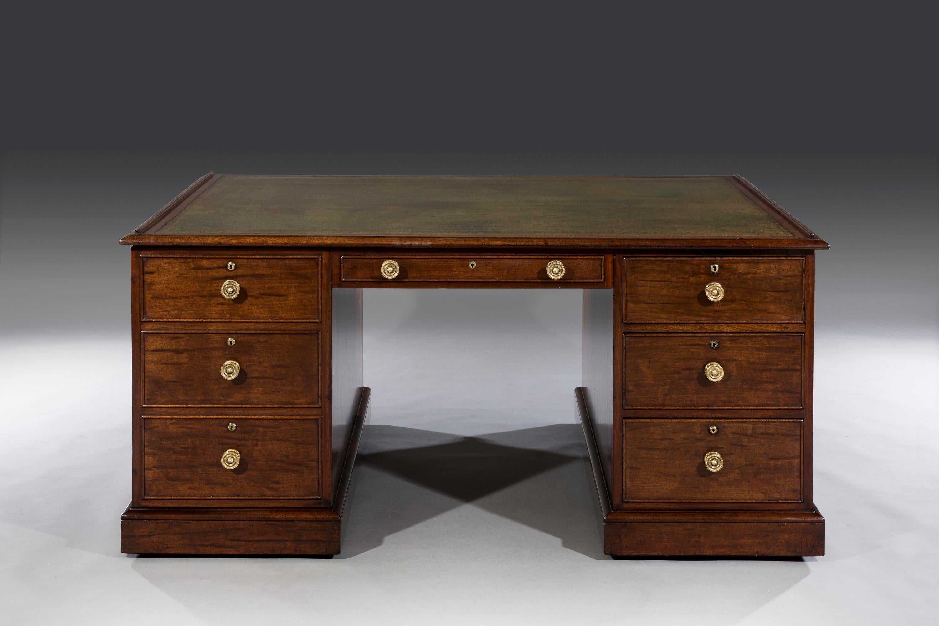 Early 19th century Regency period mahogany partners pedestal desk.