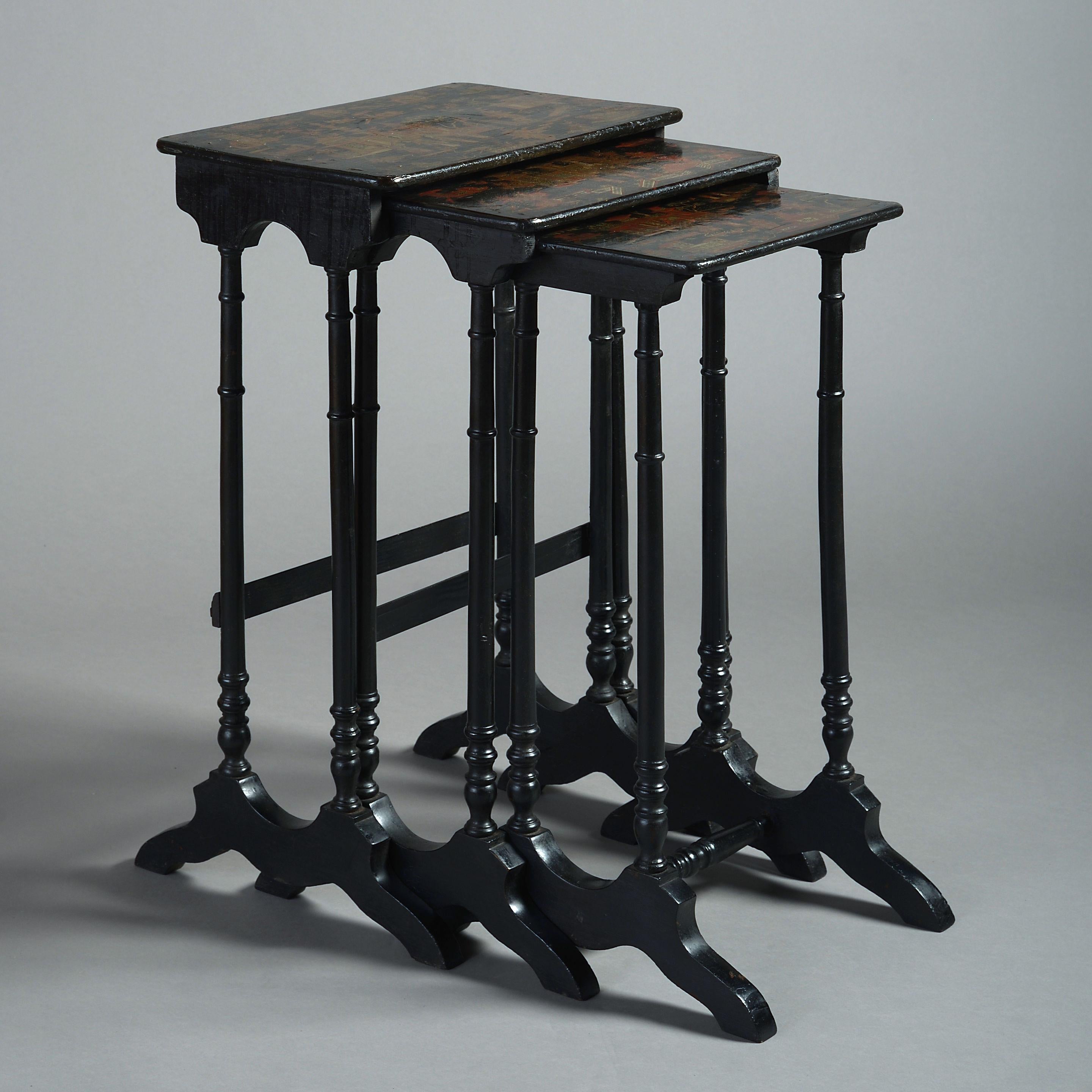 An early 19th century Regency period chinoiserie black and gilt lacquer nest of three tables.