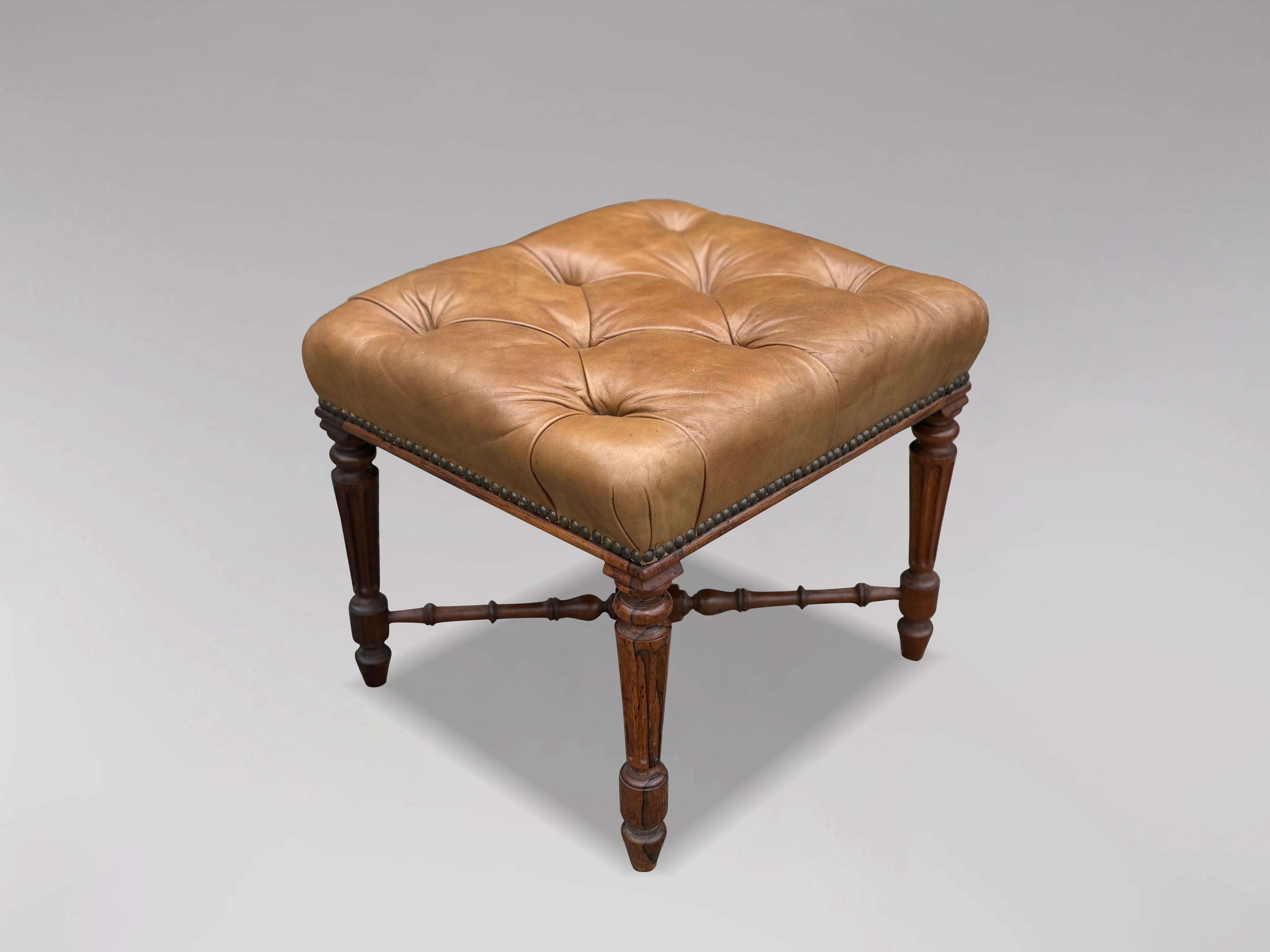 This early 19th-century Regency period rosewood stool is a charming example of elegant craftsmanship. Its excellent colour and patina speak to its well-preserved condition and the quality of the materials used.
The stool features a rectangular,