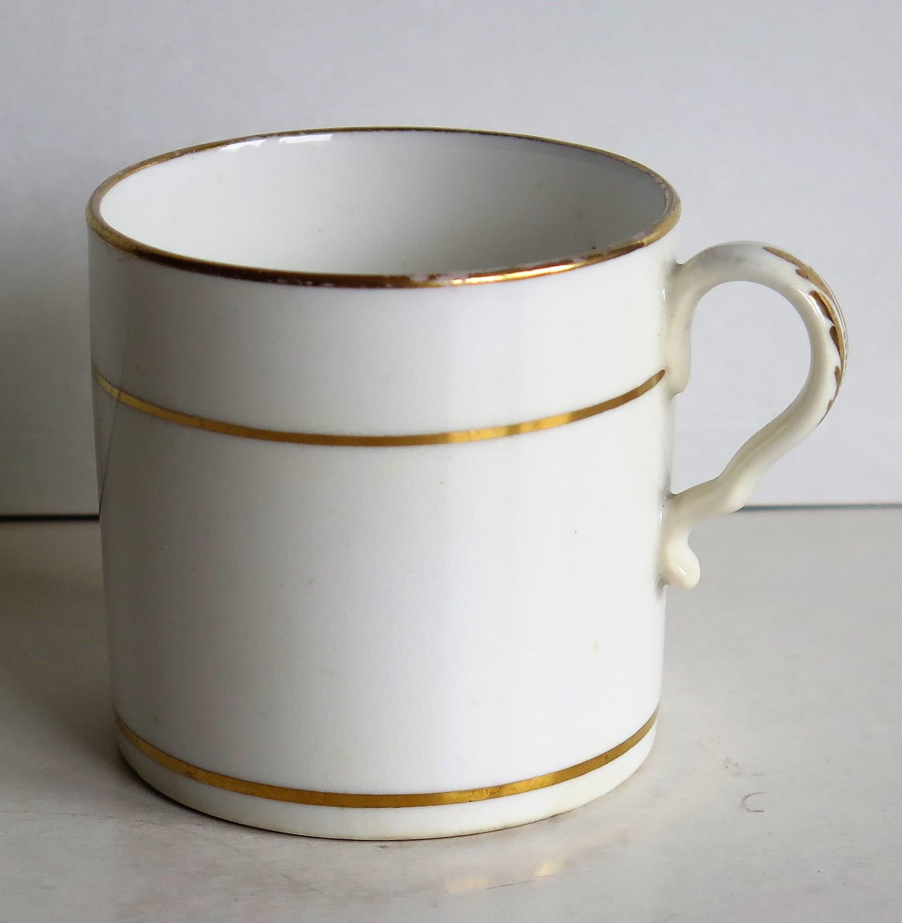 This is a fine example of an English George III, Regency period, porcelain, coffee can (cup), made by Spode in the early 19th century, circa 1810.

The can is nominally straight sided and has the Spode loop handle with a pronounced kick or kink to
