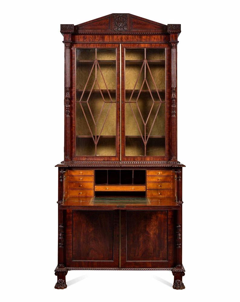 Period Regency mahogany secretary bookcase. Carved neoclassical elements. Pediment with carving and carved hairy pay feet. Drop down interior to reveal original compartments in satinwood. The Best of the Best of this period. English or Irish.

Ex: