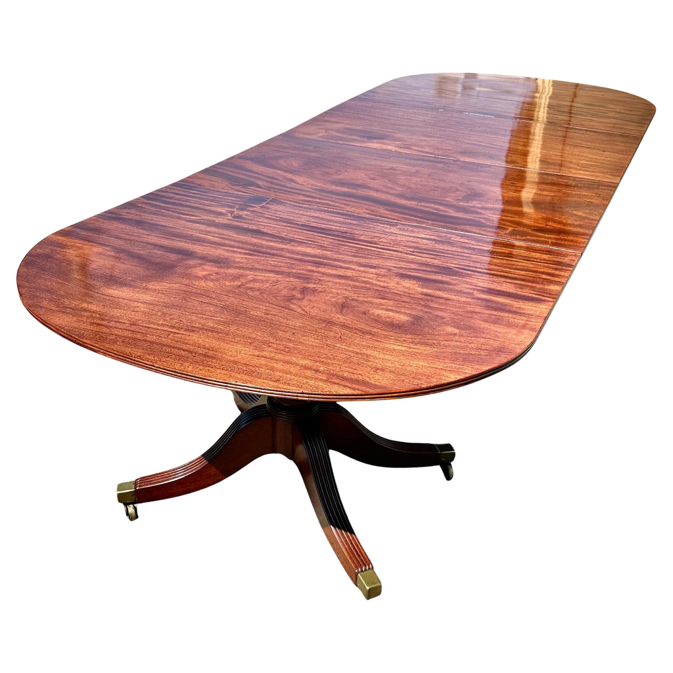 Early 19th Century English Regency Two Pedestal Dining Table.  Wonderful patina and mellow color.  Two original leaves to extend length.  Original tip top mechanisms on each section.  

Fully Extended at 124