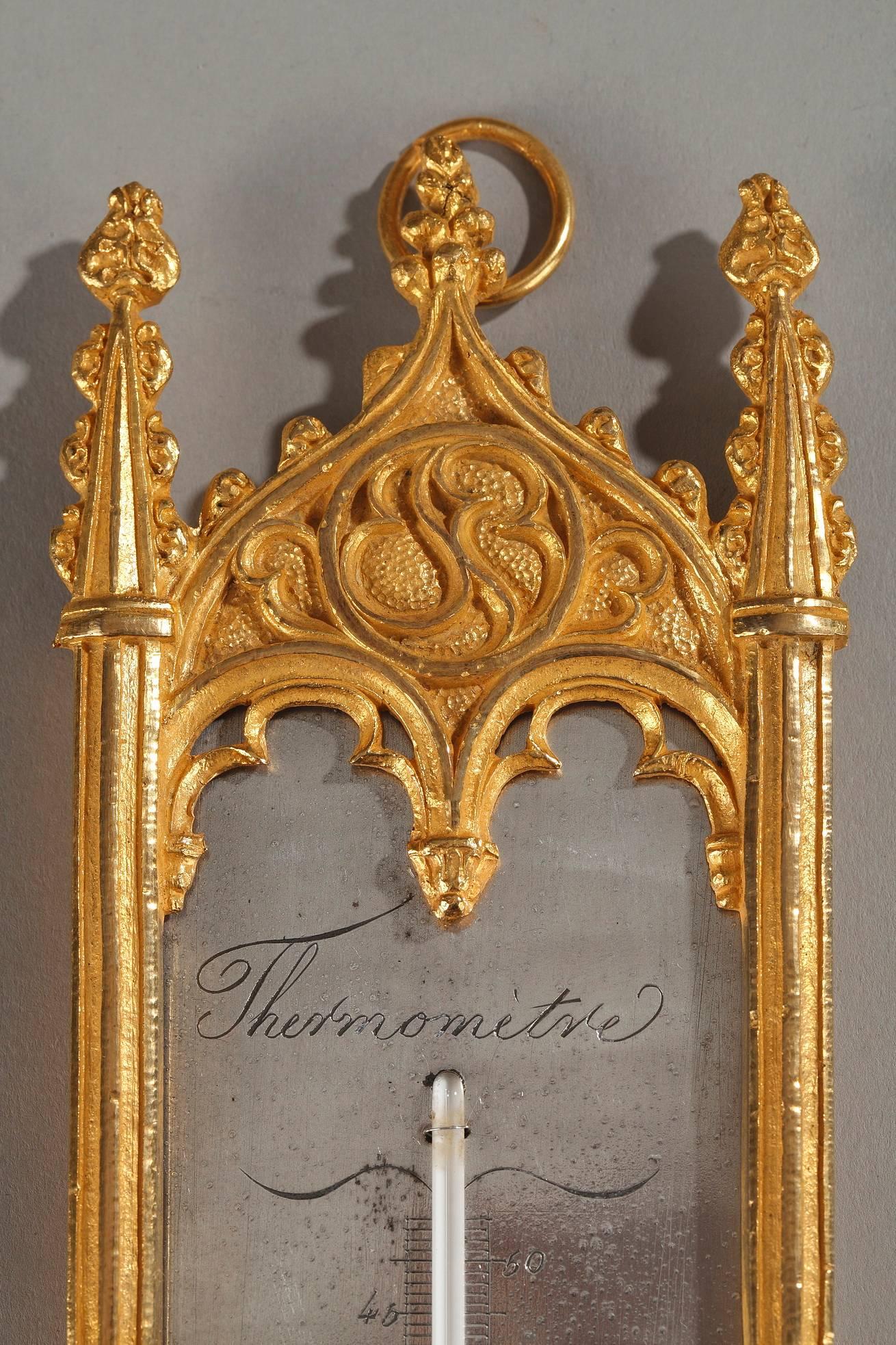 Early 19th century Romantic-period thermometer and semainier crafted in ormolu or gilt bronze. The semainier is a calendar that tracks the days of the week. Both thermometer and semainier are in Neo-Gothic style, embellished with rosette, arches,