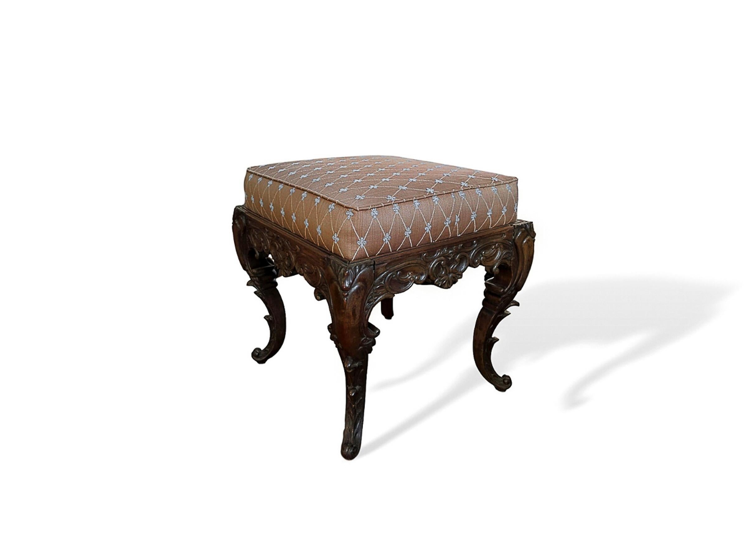 Early 19th century Rocco style hand carved mahogany stool with re-upholstered top.