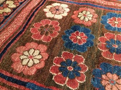 Rose and Blue Khotan Fragment Rug, Early 19th Century