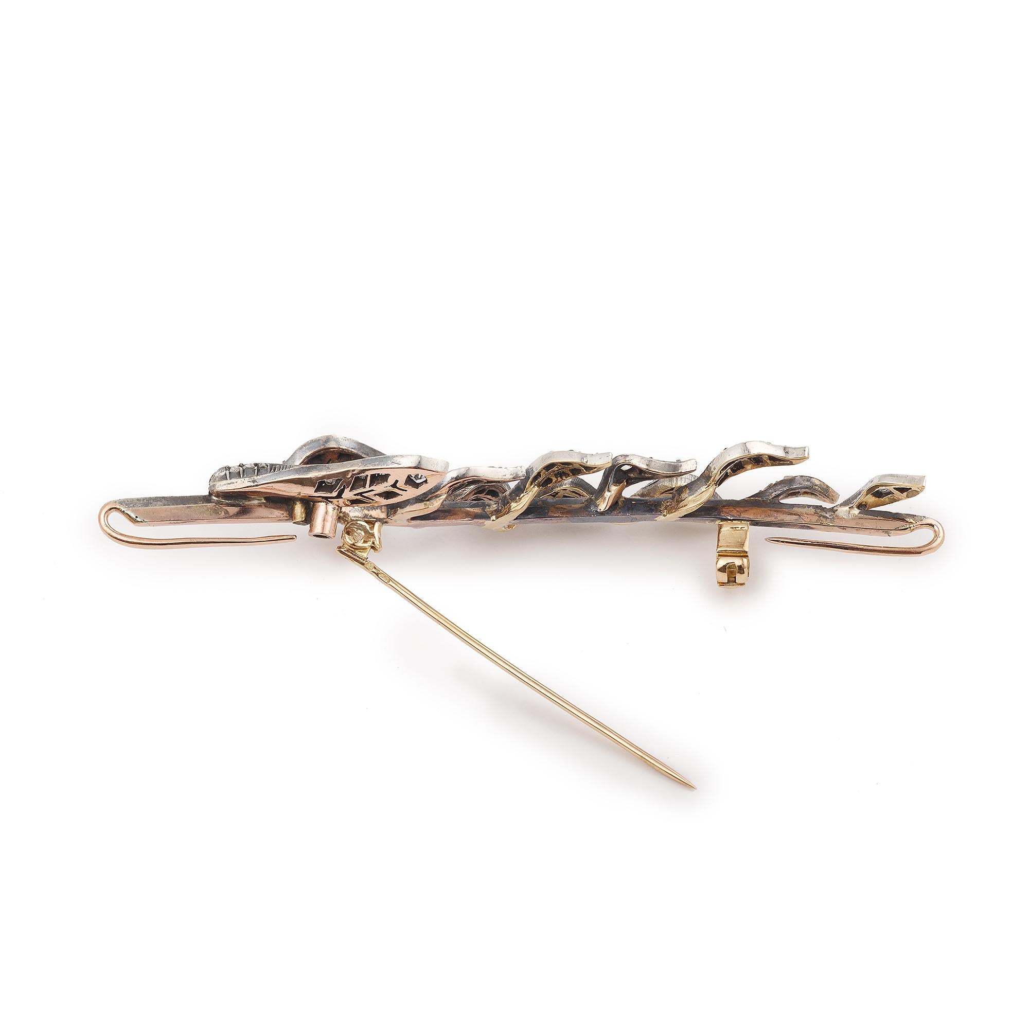 Very nice brooch in yellow gold and silver in the shape of a small branch. It is set with small rose-cut diamonds.

Dimensions : 84.53 x 21.17 mm (3.328 x 0.833 inches)

Weight : 11.60 g

Total approximate weight of the 74 diamonds: 0.75 carats

18