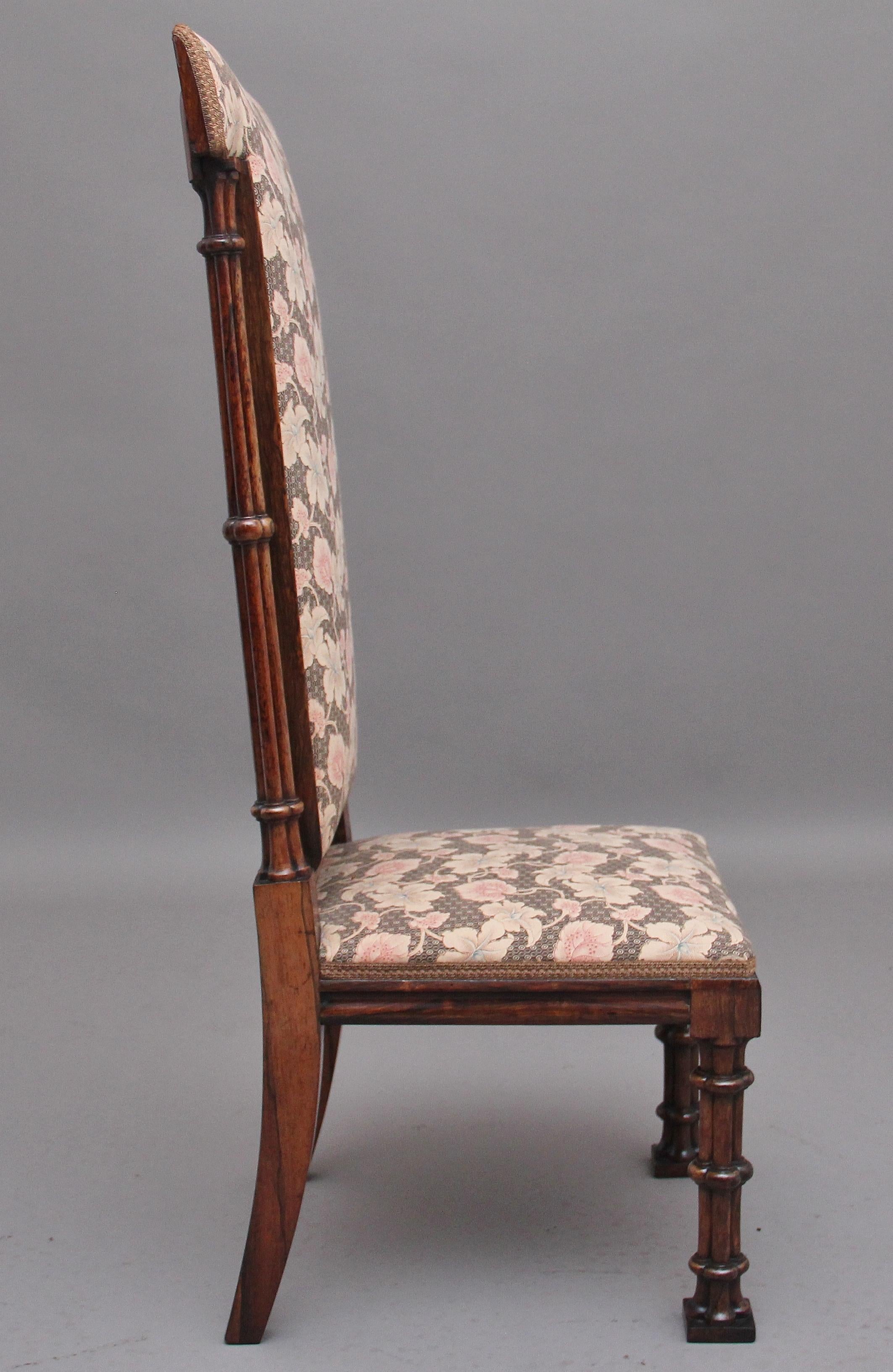 A lovely quality Regency rosewood side chair in the Gothic style, the padded high back upholstered in a decorative floral pattern along with the cushioned seat, either side of the high back there are elegant turned supports leading down to the