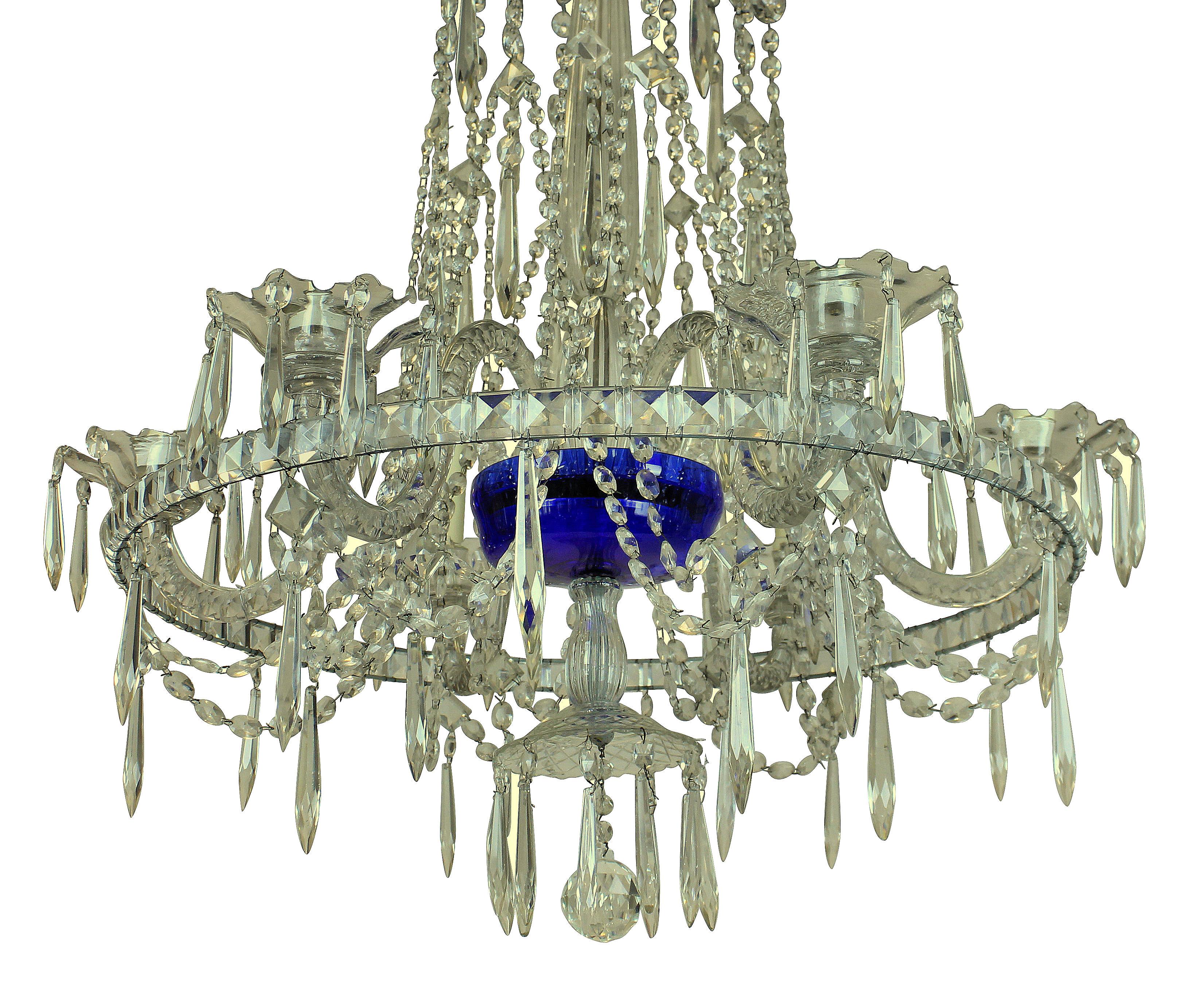 A fine early 19th century Russian cut-glass chandelier. Of six arms, supporting a corona, with baluster stem and Baltic blue glass dish. Hung throughout with cut-glass swags.
 