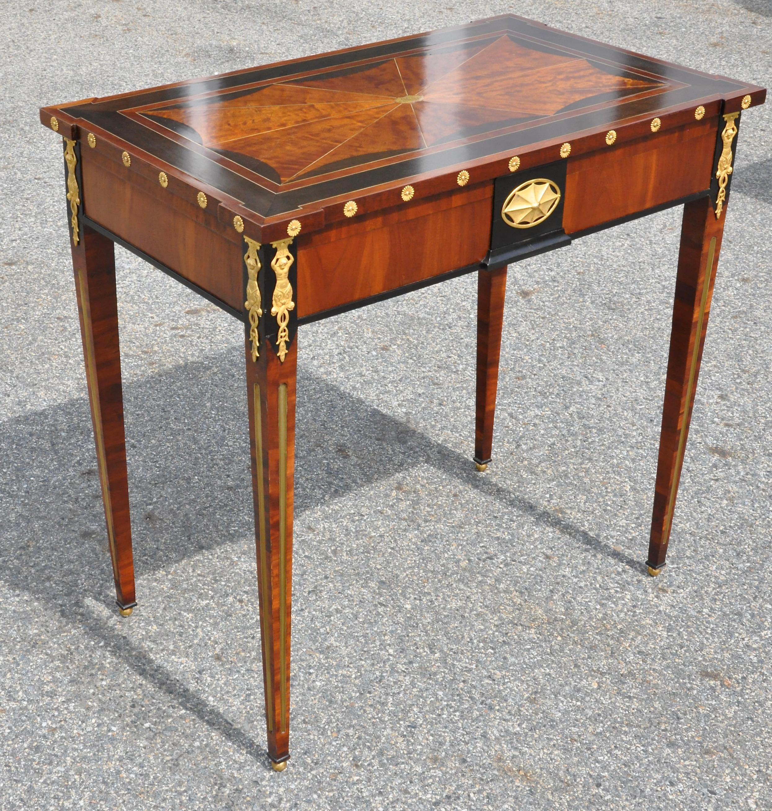 Period Russian neoclassical table with original planter insert. Attributed to Heinrich Gambs. Ebony and figured birch, brass inlay. Top bearing family monogram. Original ormolu mounts. Tables such as this were used as both side or console tables and