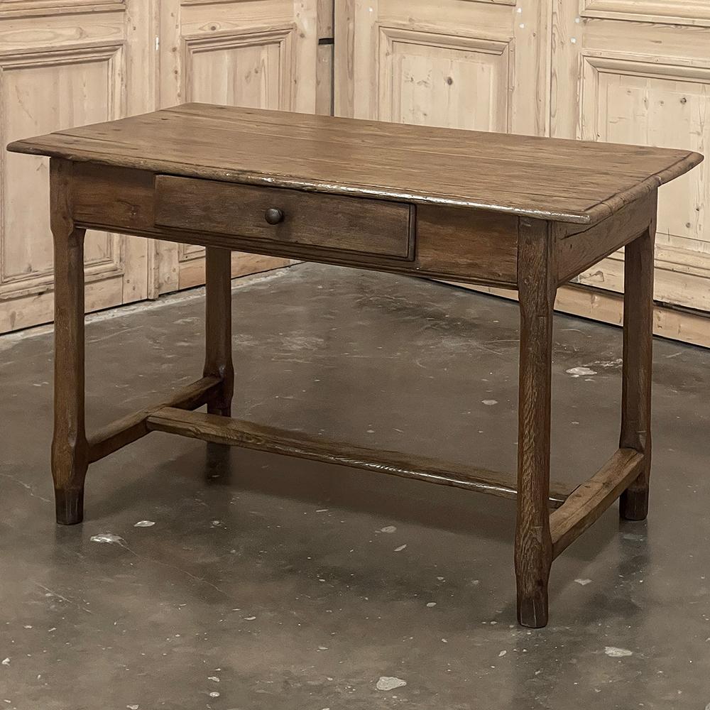Early 19th Century Rustic Country French End Table represents a splendid example of Old World craftsmanship displaying techniques handed down from generation to generation to provide sturdy furnishings built for daily use.  This example, rendered