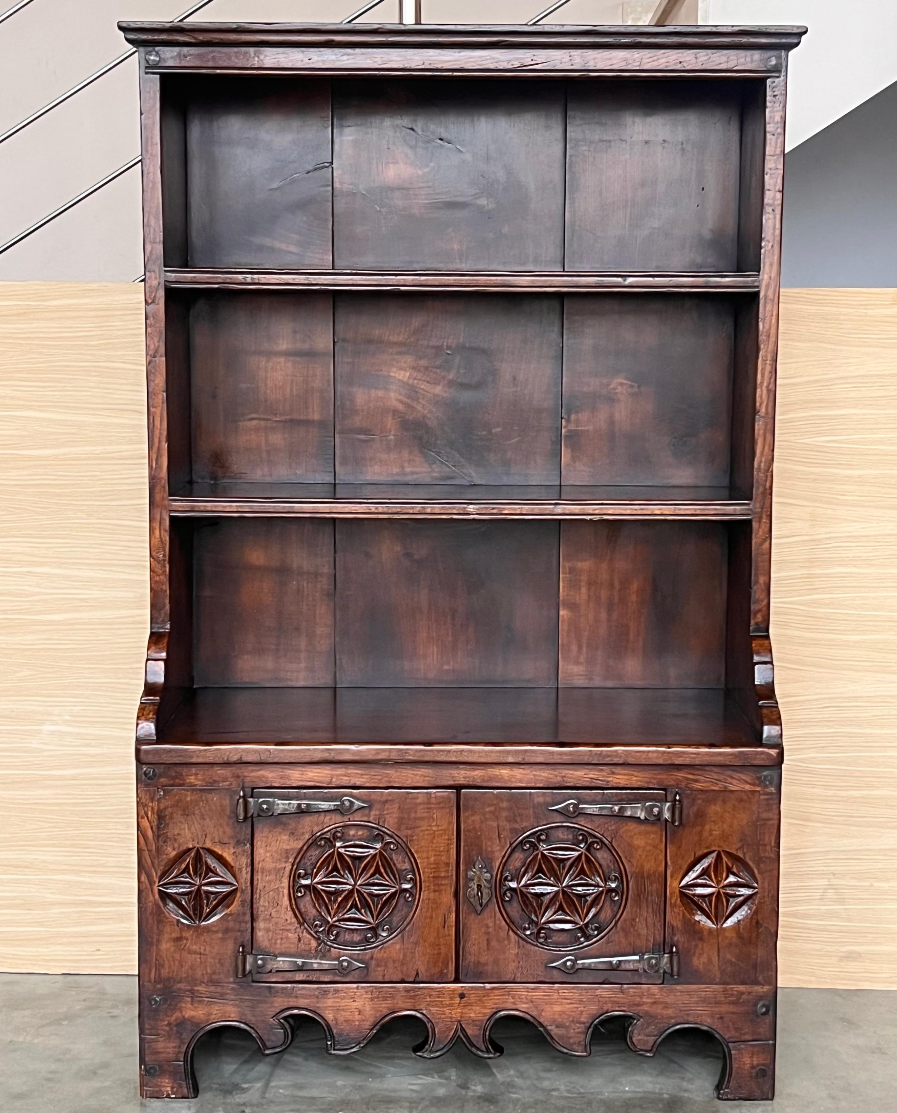 Early 19th century Rustic Spanish open bookcase is a relic from the distant past, ready to serve your family for generations yet to come! Hand-hewn from old-growth timbers of solid walnut, it was produced using time-honored techniques of full