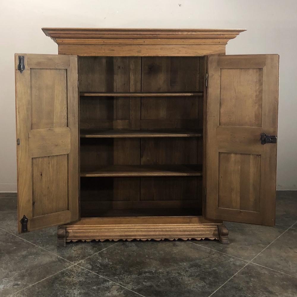 Early 19th Century Rustic Dutch Stripped Hand-Carved Oak Armoire In Good Condition In Dallas, TX